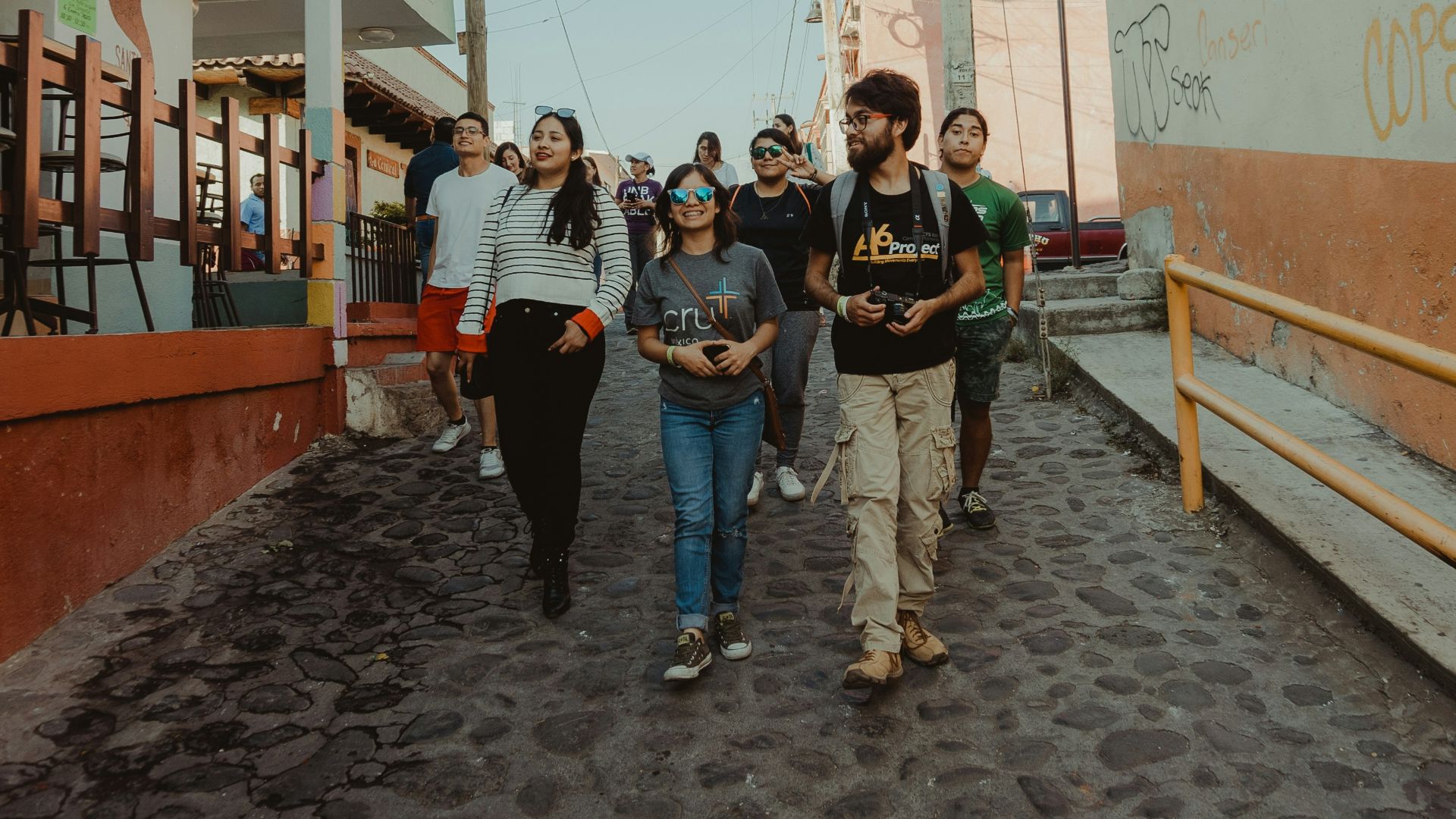a group of people walking down a street