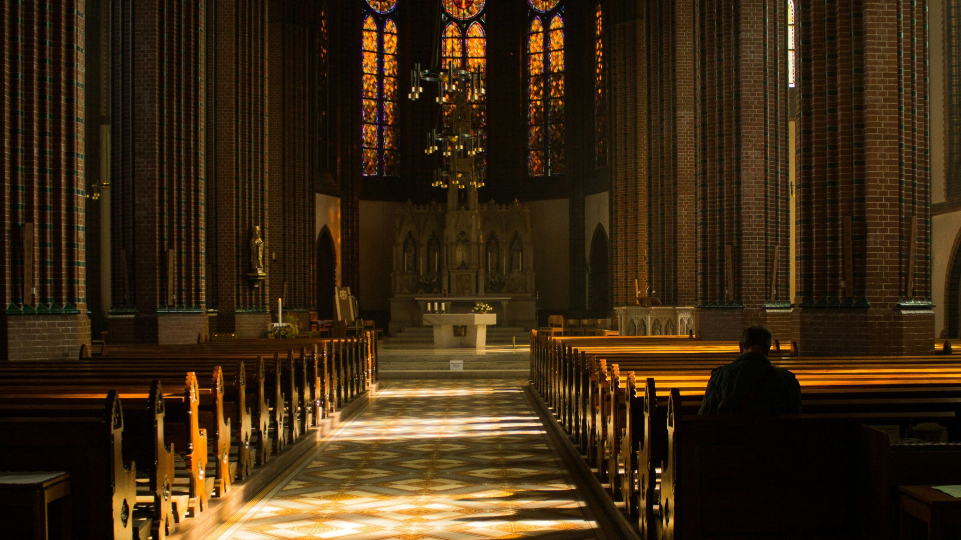 brown wooden chairs inside church
