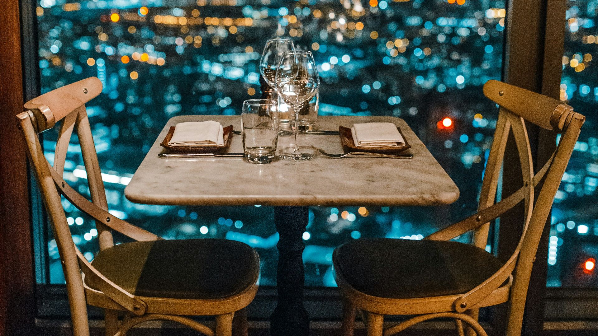 white ceramic table and chairs with glassware