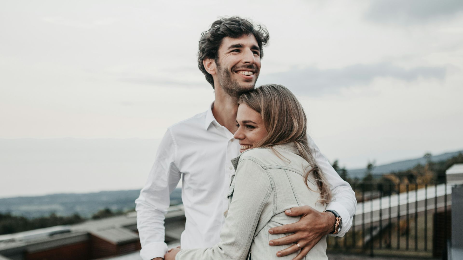 man and woman hugging each other
