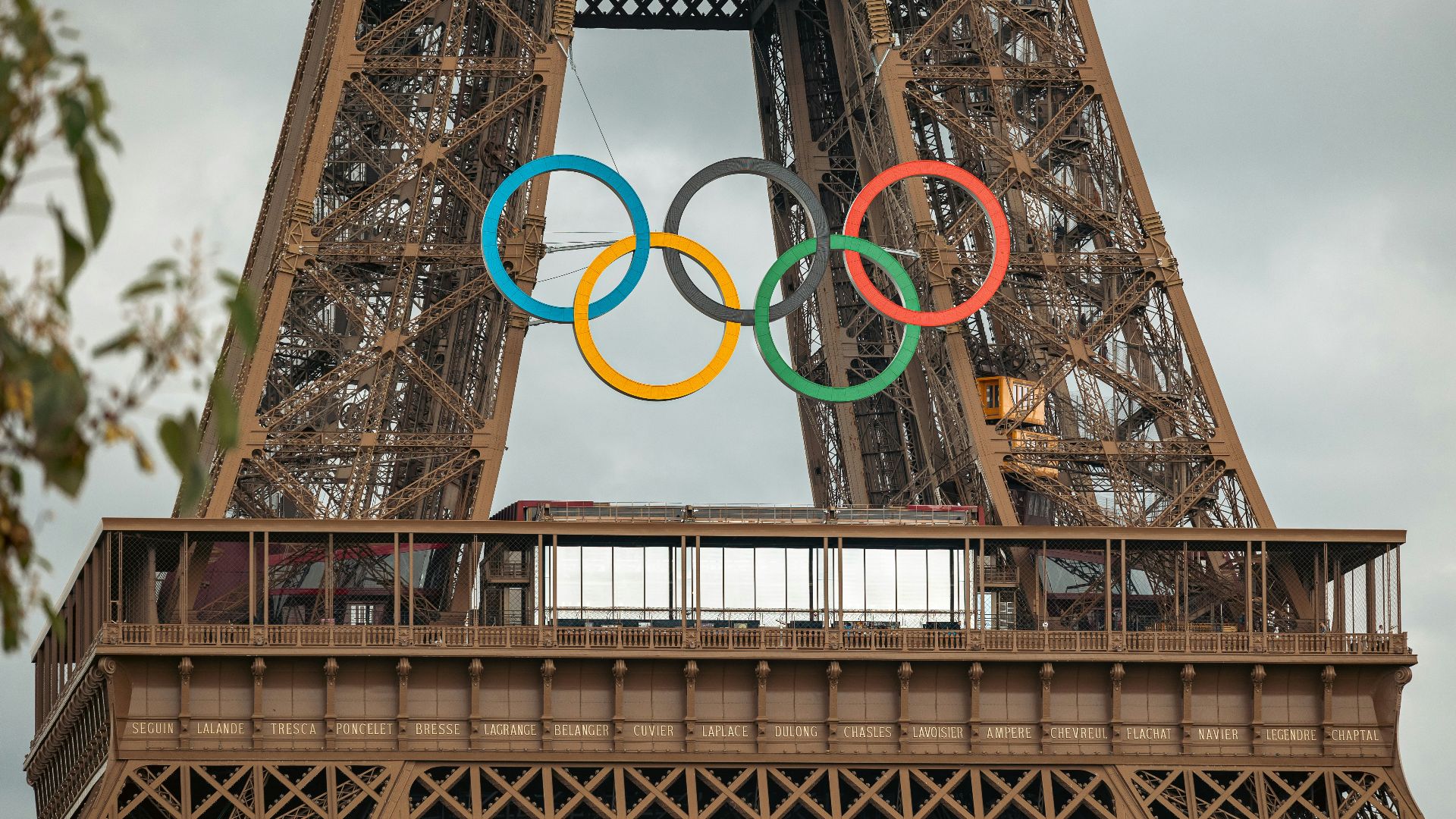 The eiffel tower with the olympic rings on top