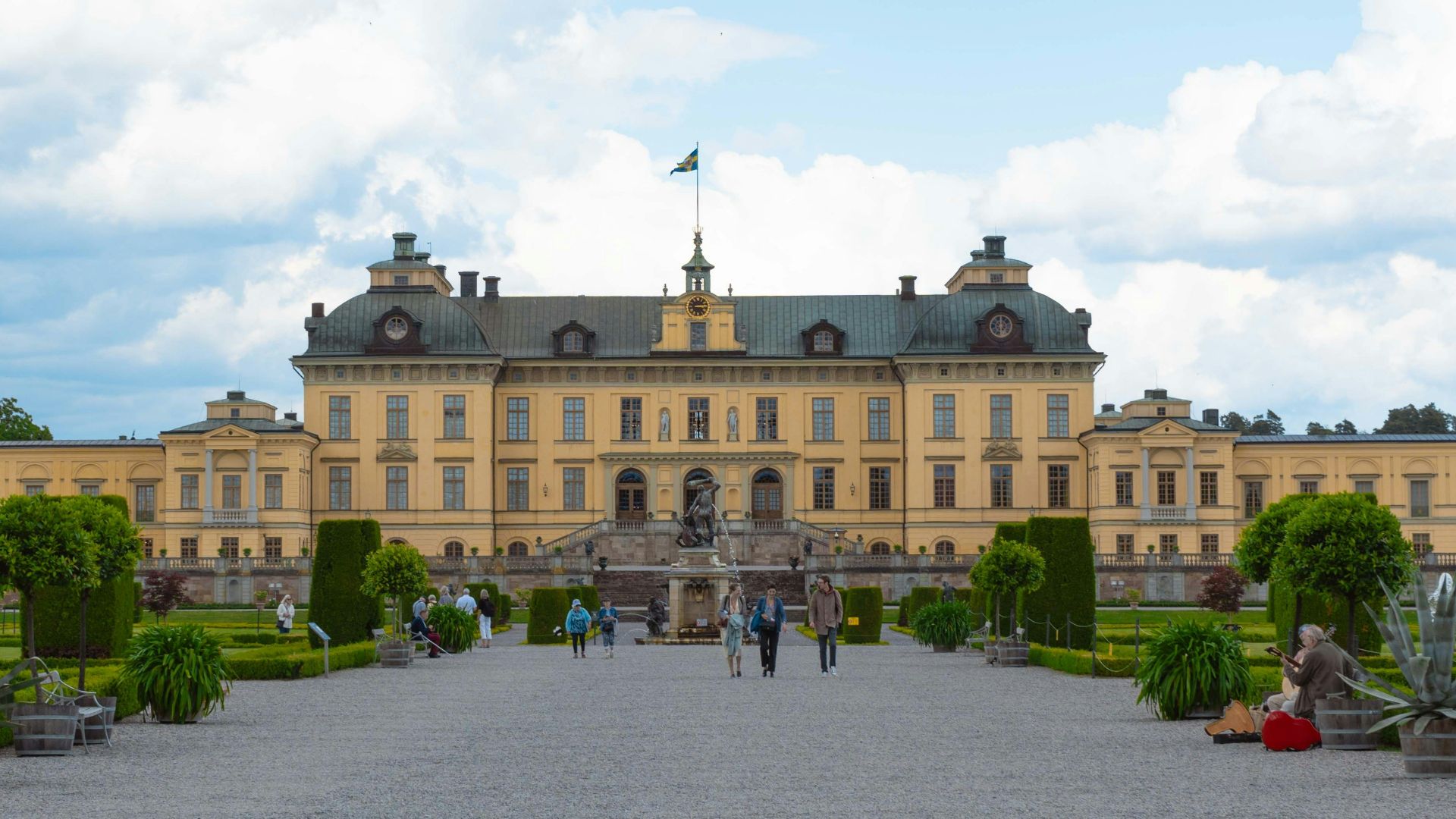 A large building with a lot of trees in front of it