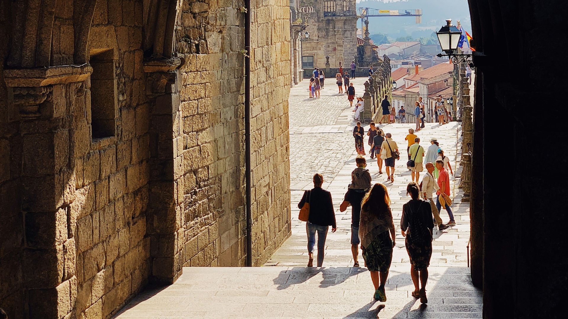 people standing beside concrete walls during daytime