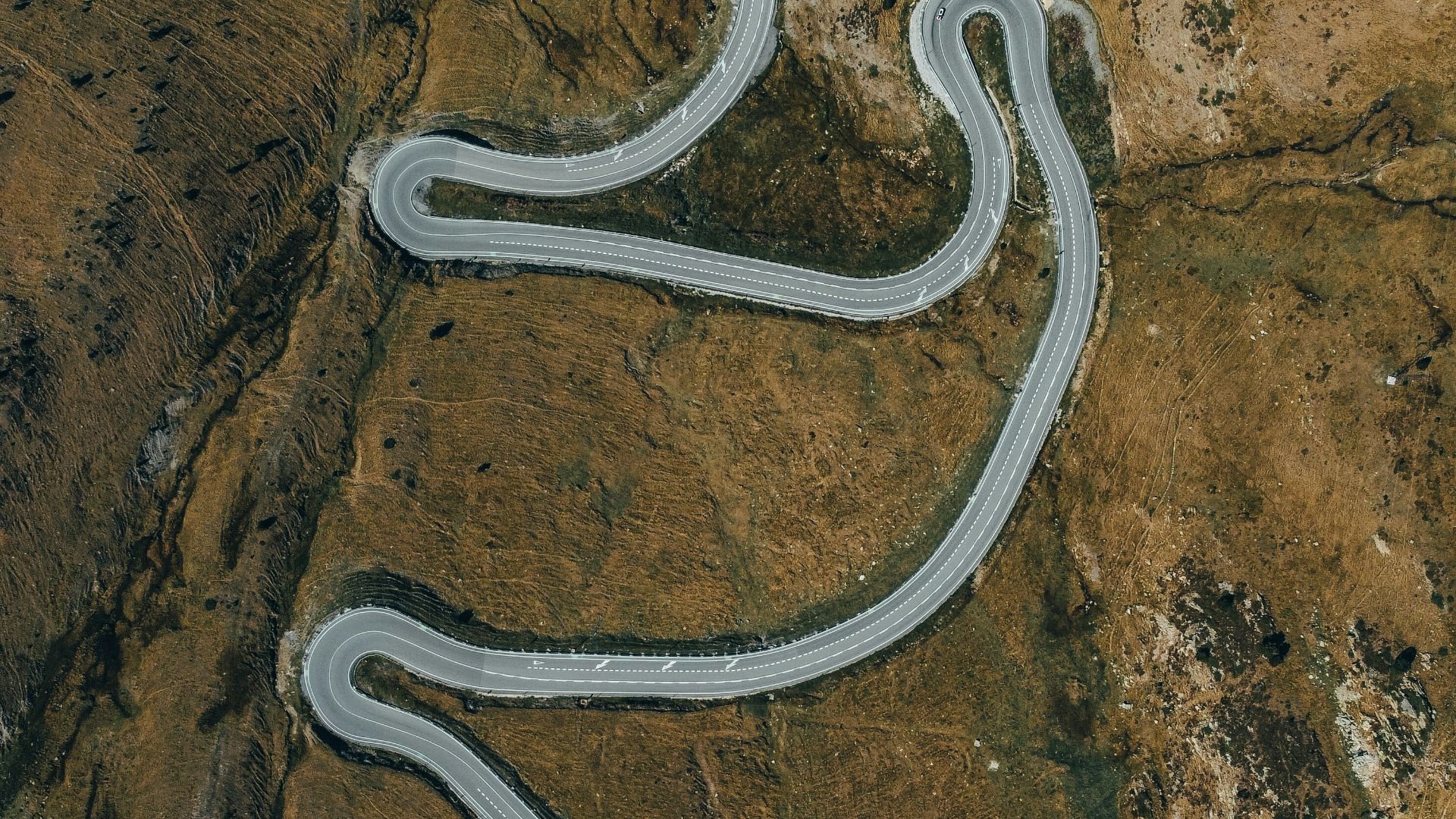 a winding road in the desert