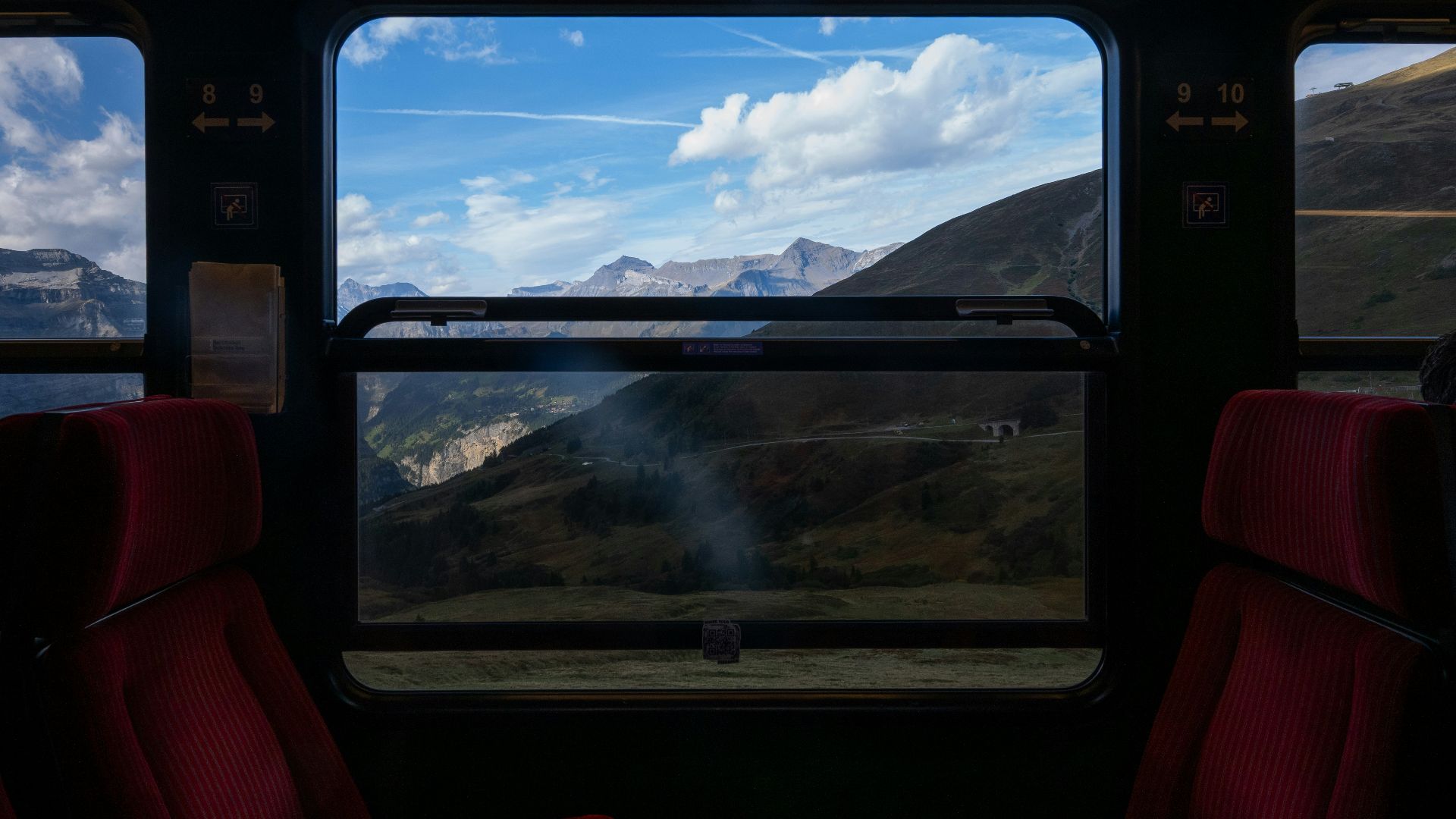 View of mountains through train window