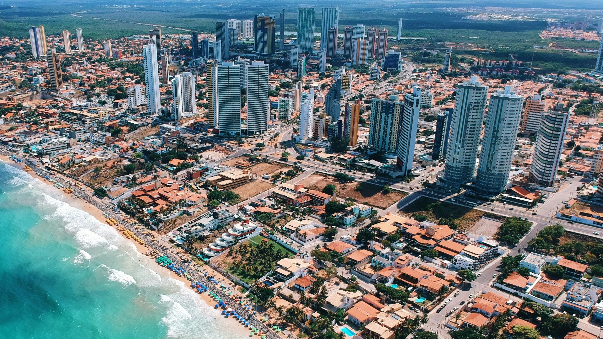 aerial photography of city building near the seashore during daytime