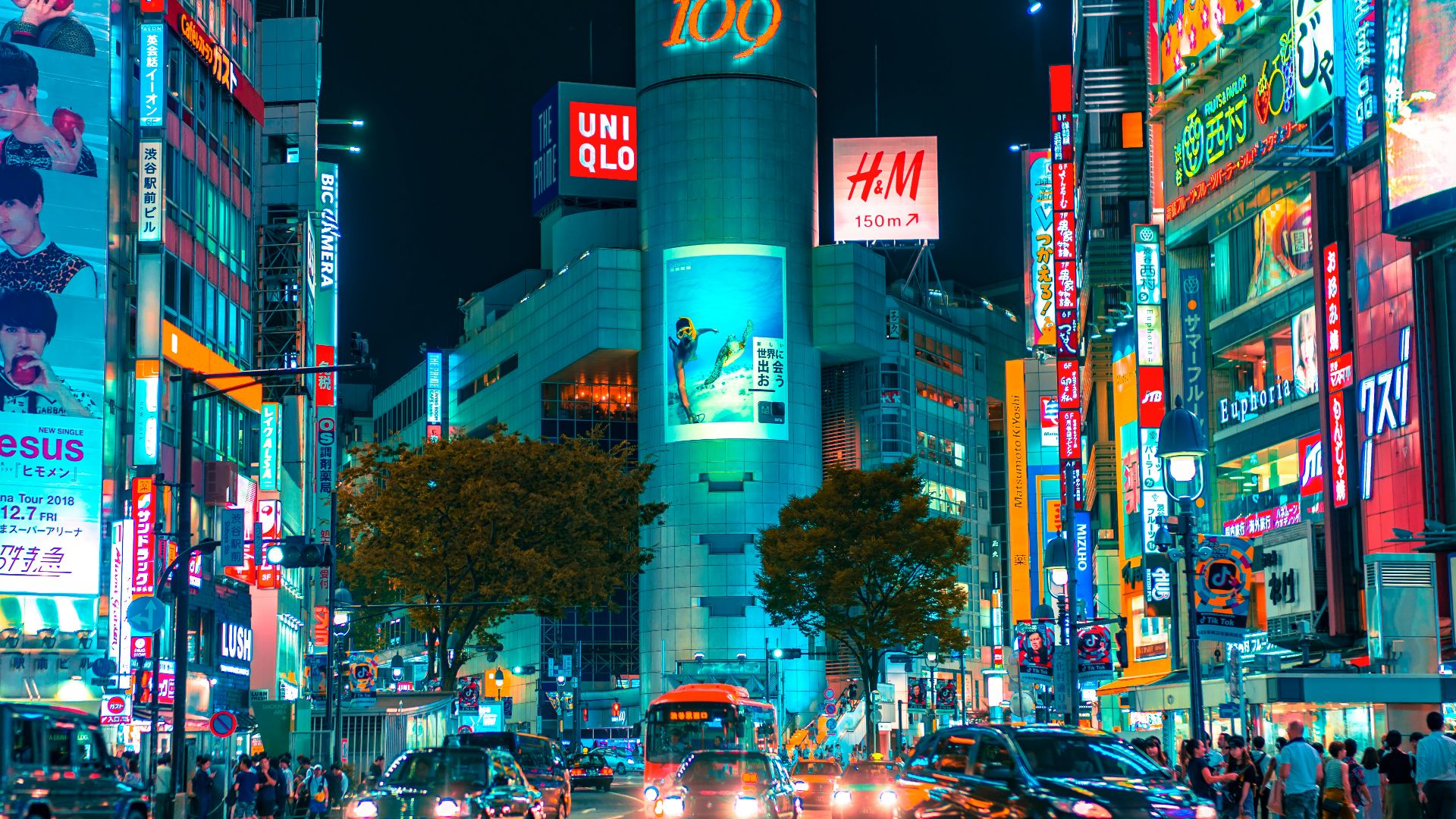people gathered outside buildings and vehicles