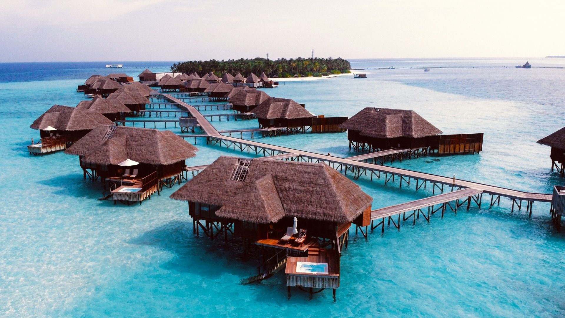 brown wooden cottage on blue body of water during daytime