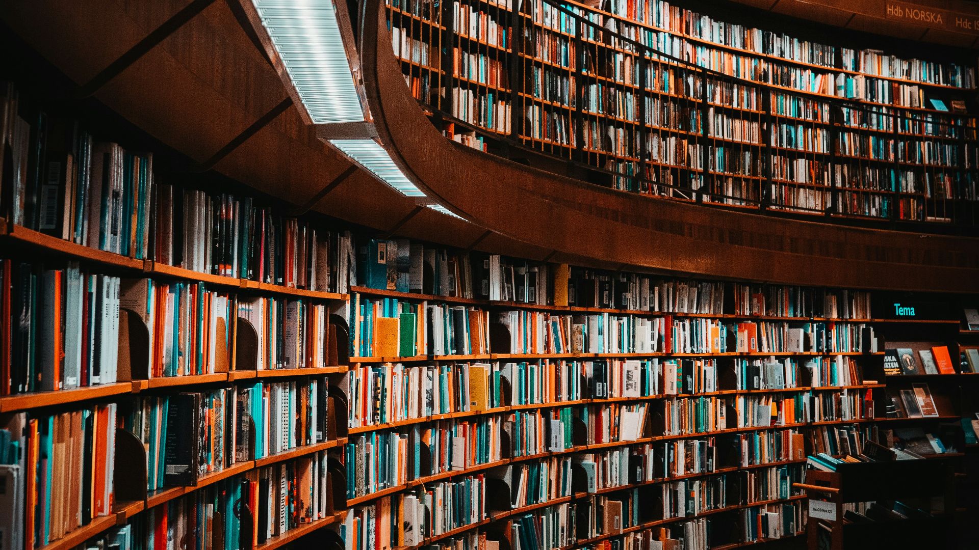 photo of brown wooden bookshelf