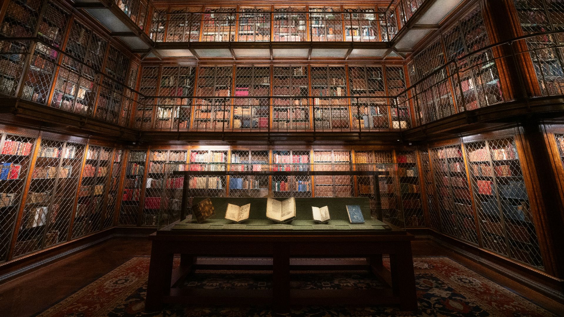 An elegant library shows many books on shelves.