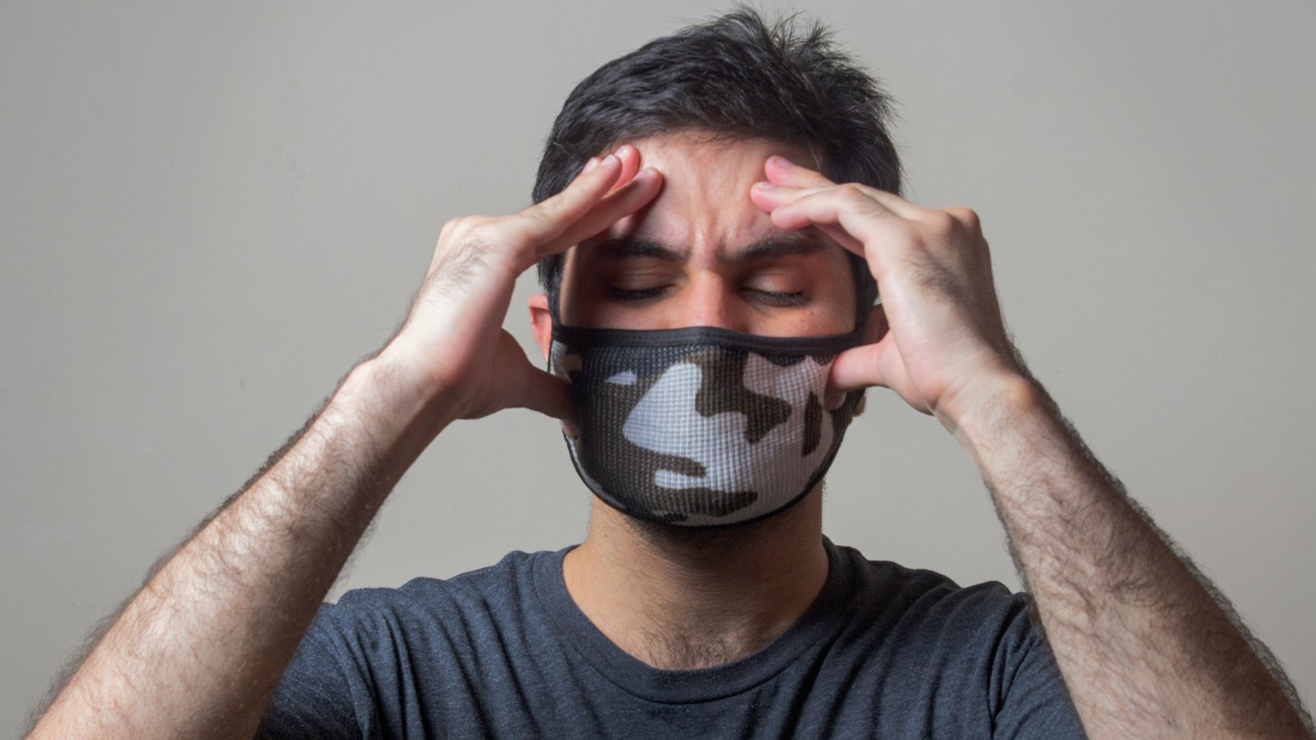 man in black crew neck t-shirt wearing black and white mask