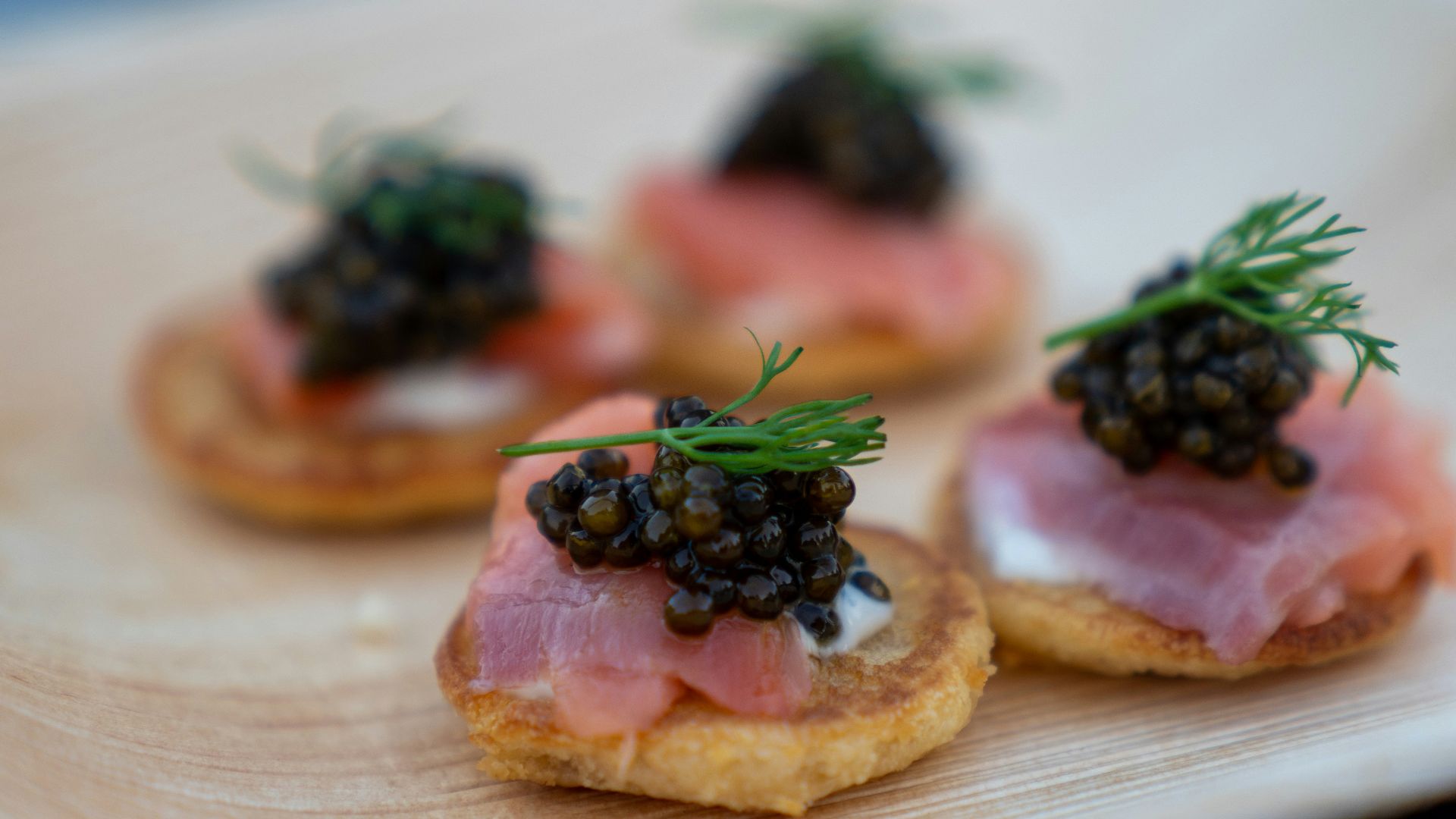 brown bread with green leaves on white ceramic plate