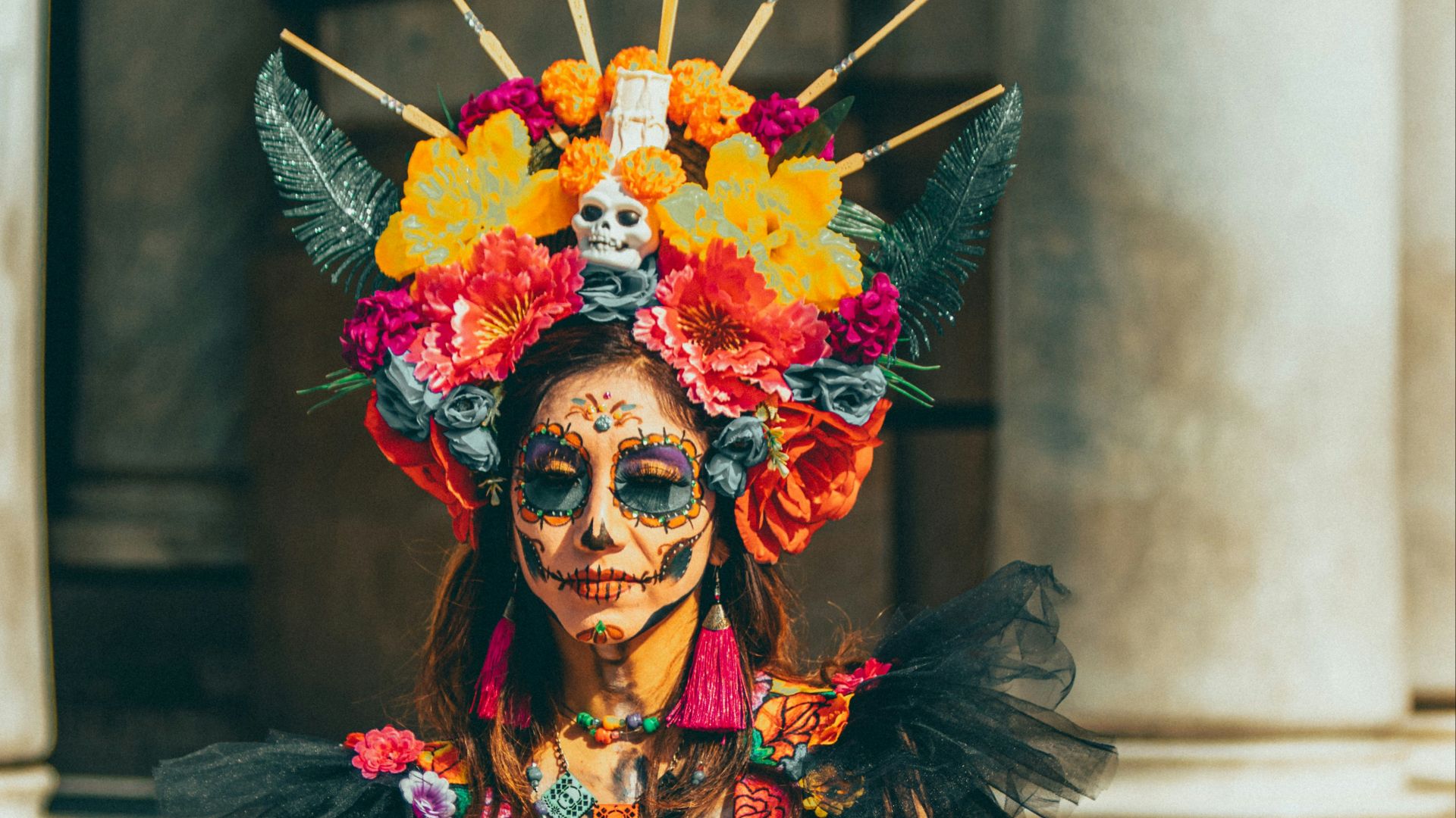 a woman in a colorful costume holding a basket