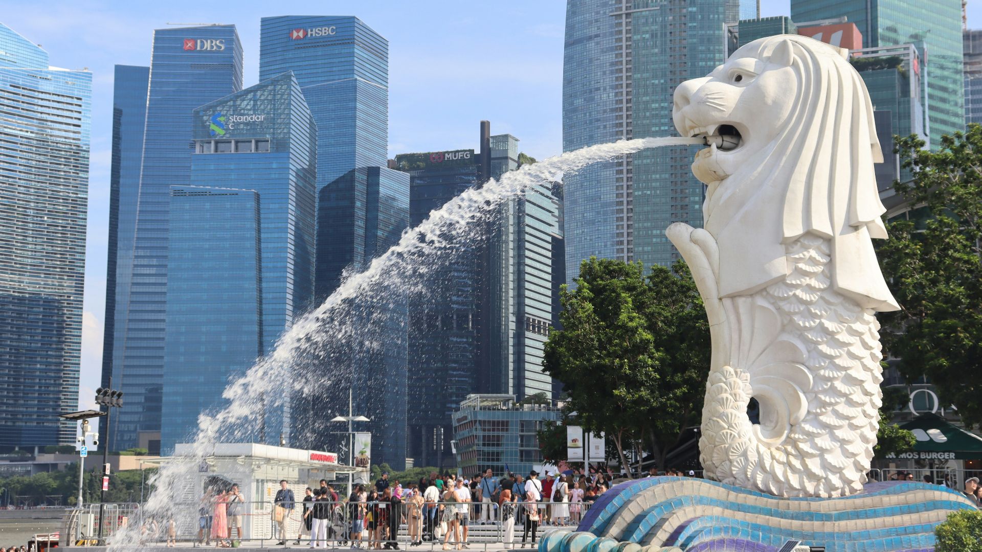 a statue of a lion spewing water into the air