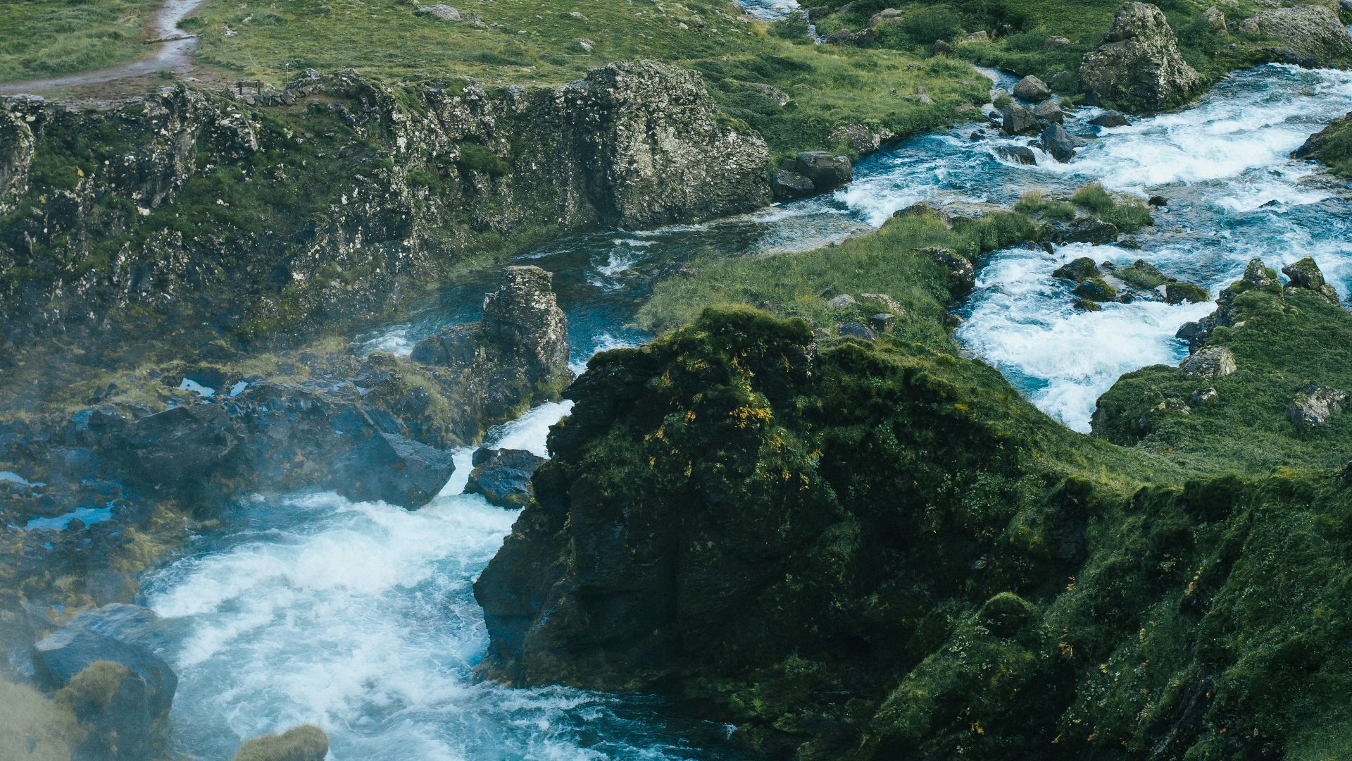 mountain ranges surrounding body of water