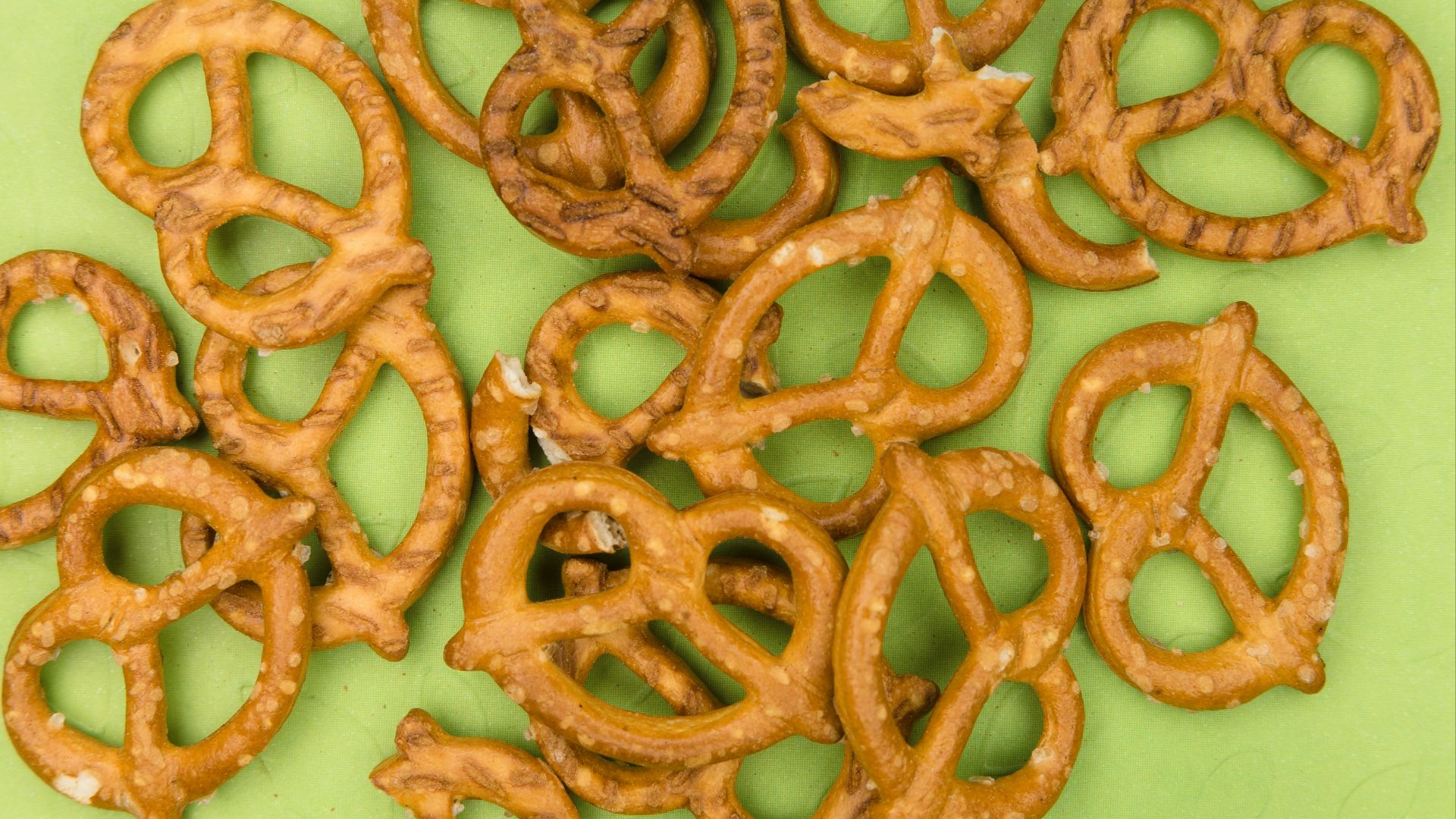 brown cookies on white and green floral ceramic plate