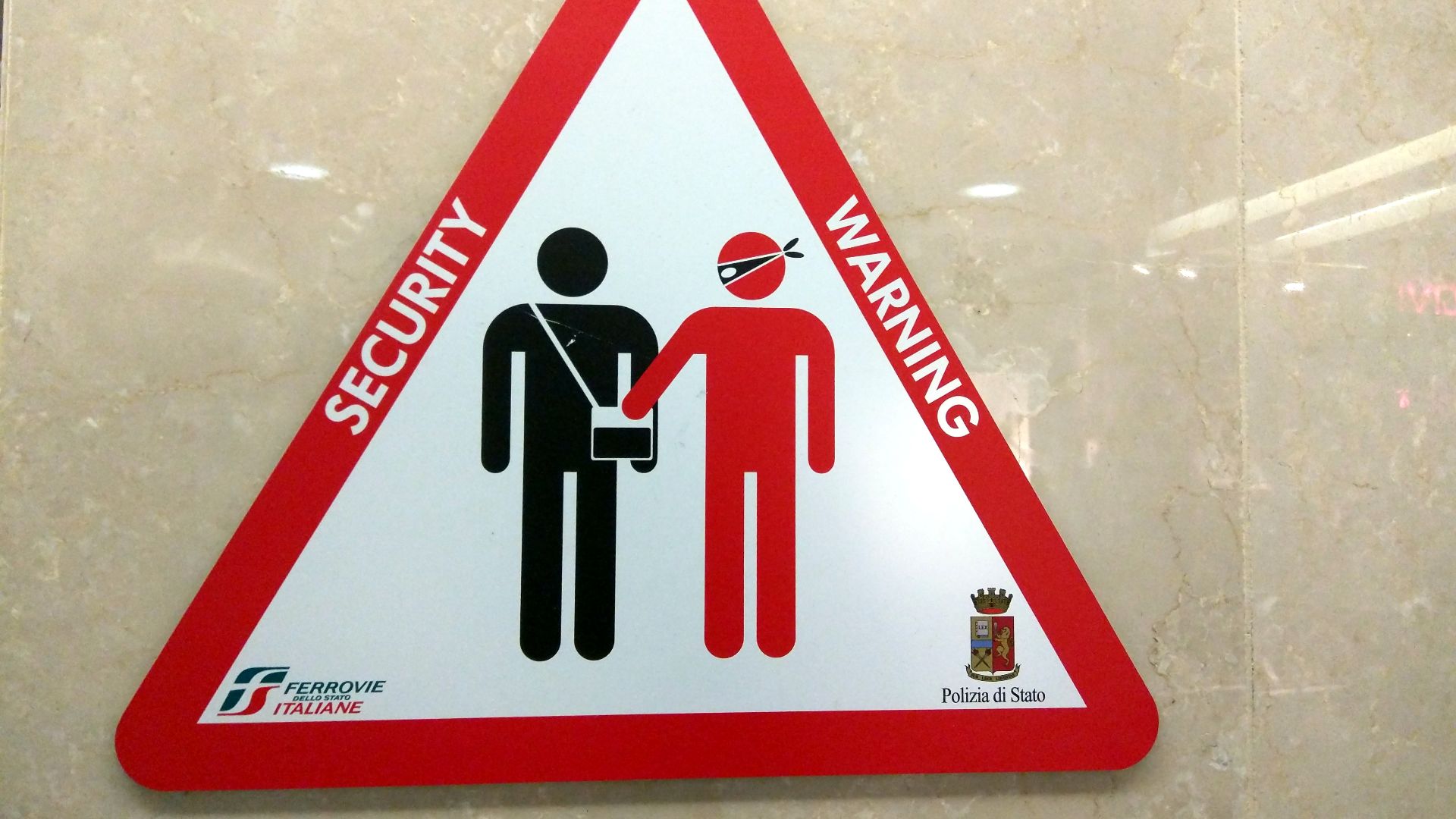 File:Pickpocket warning sign, train station, Turin, Italy (17783621312).jpg