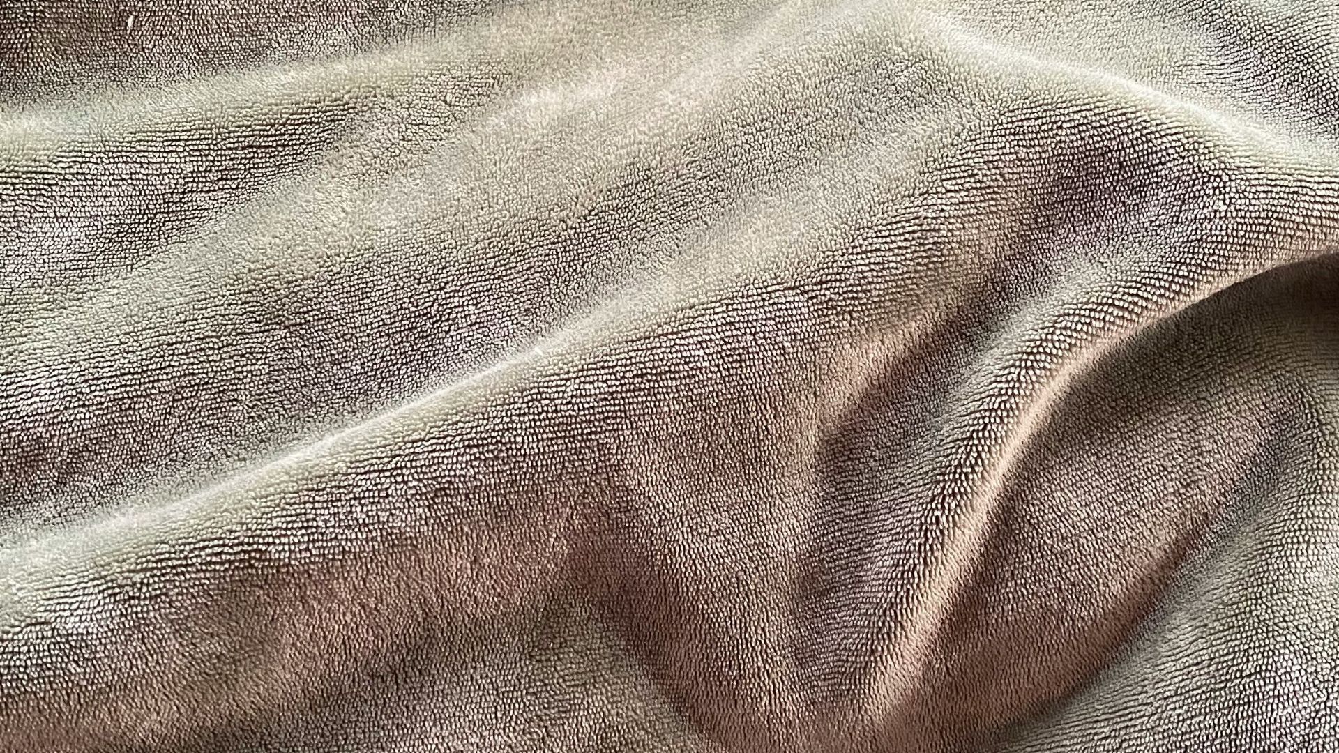 gray textile on brown wooden table