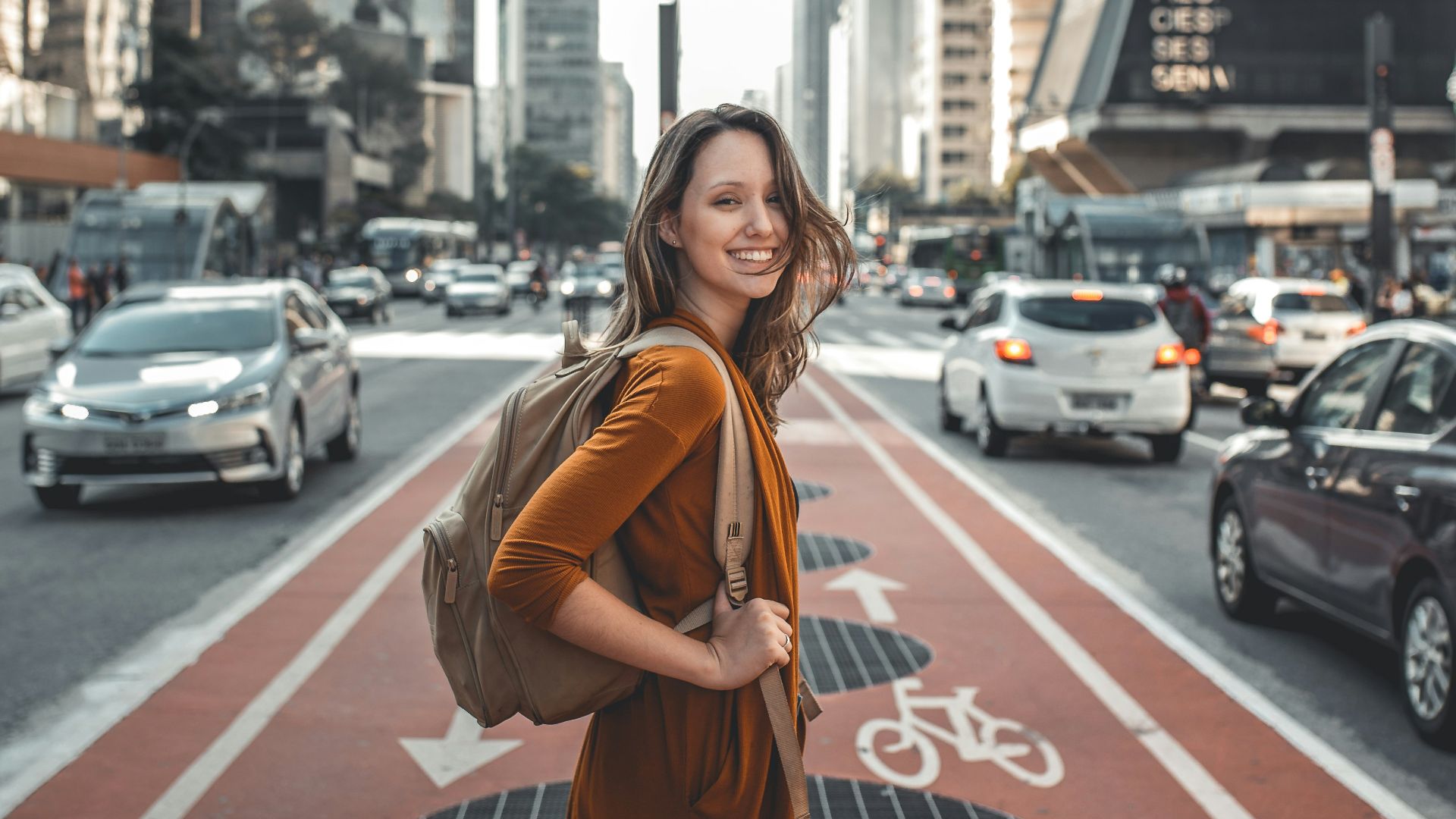 woman standing on middle of road
