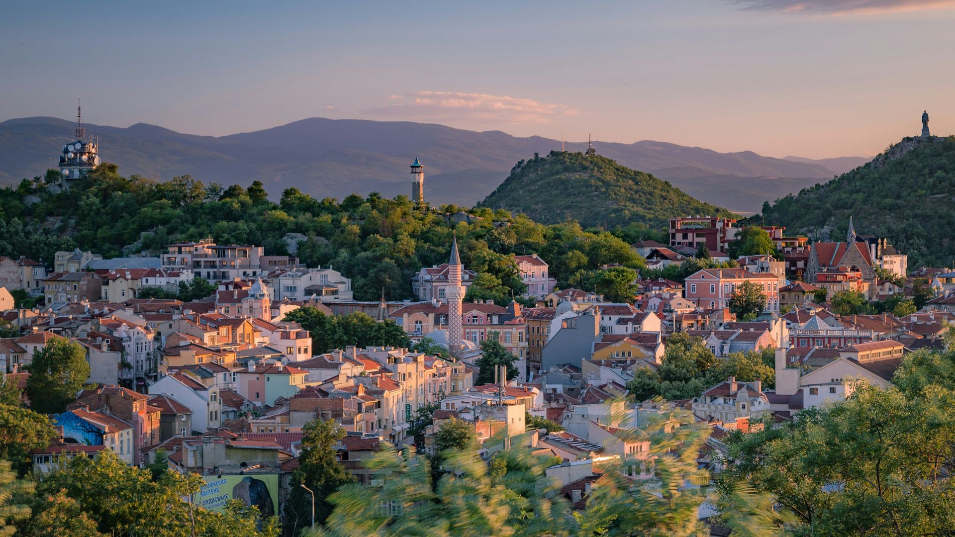 a small town surrounded by trees and mountains