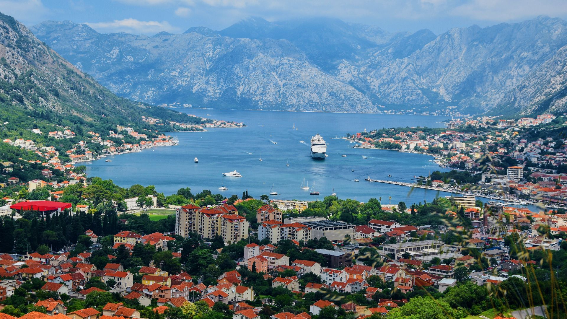 aerial view of city near body of water during daytime