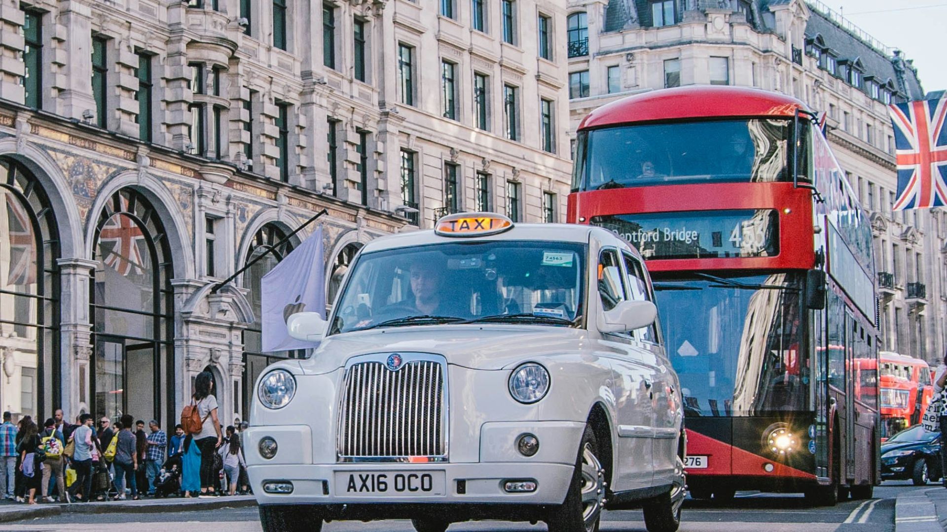 photo of car and bus near castle
