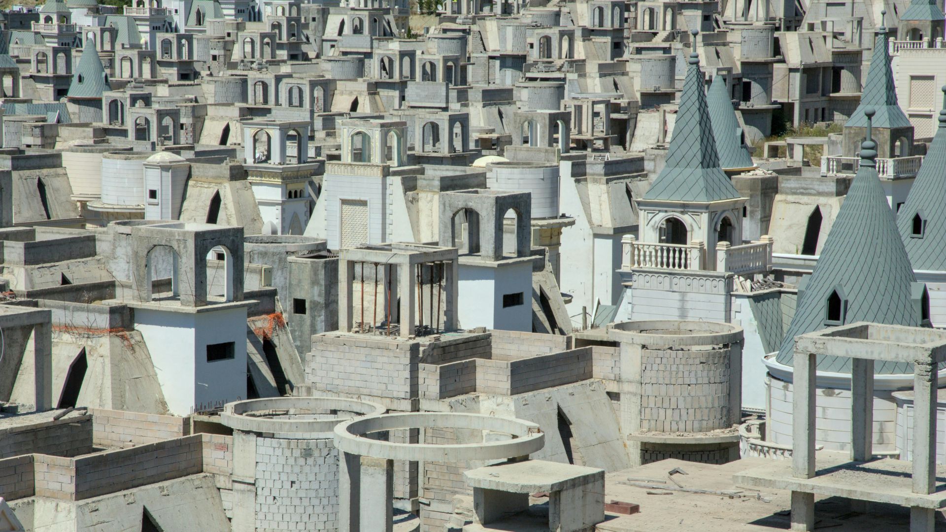 a large number of cement buildings with towers