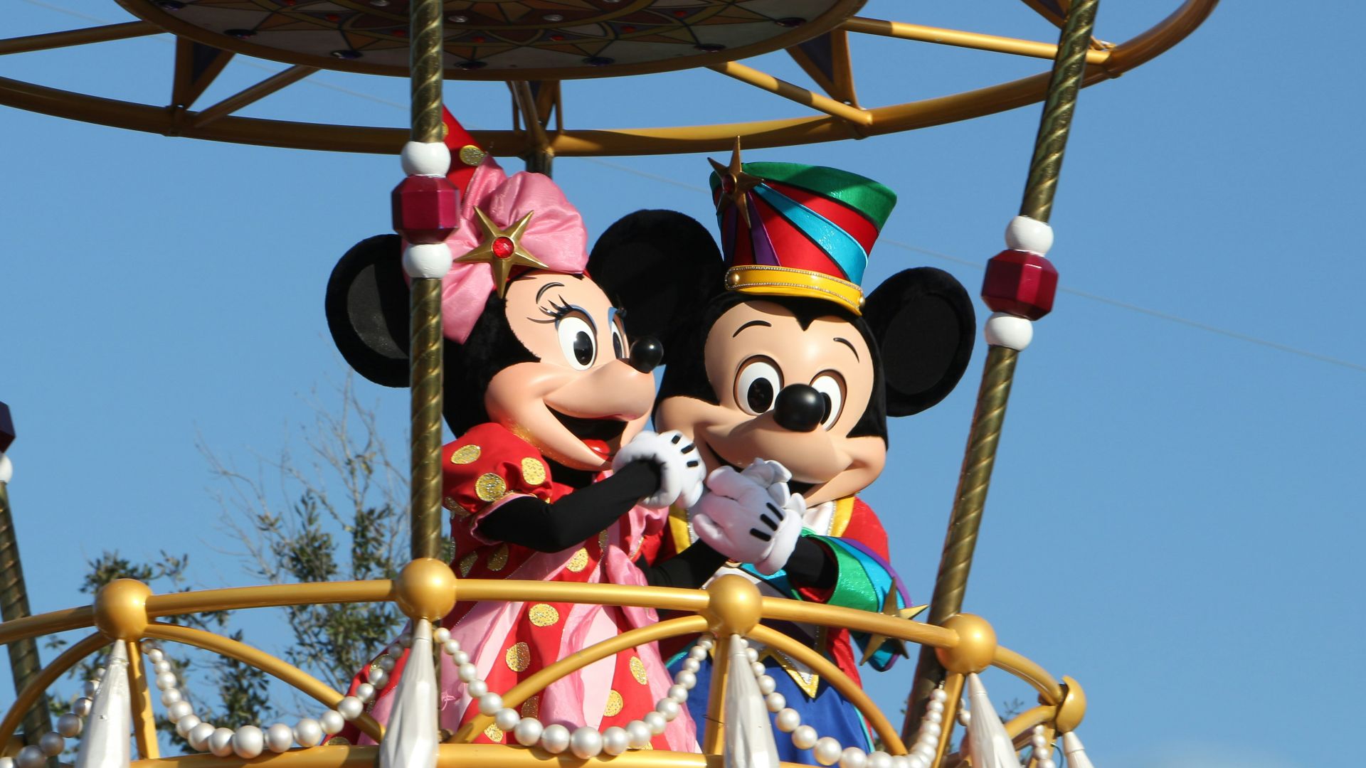 mickey mouse riding on swing ride