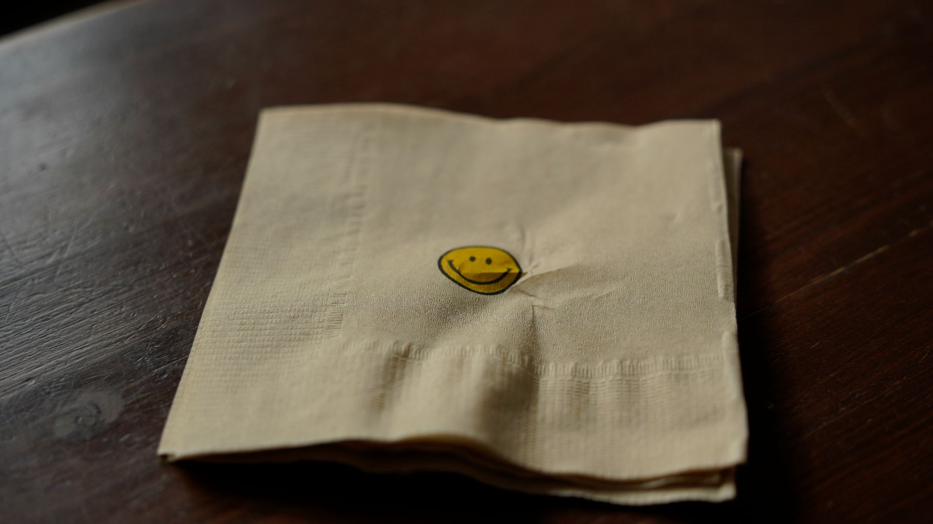 a napkin with a smiley face on it