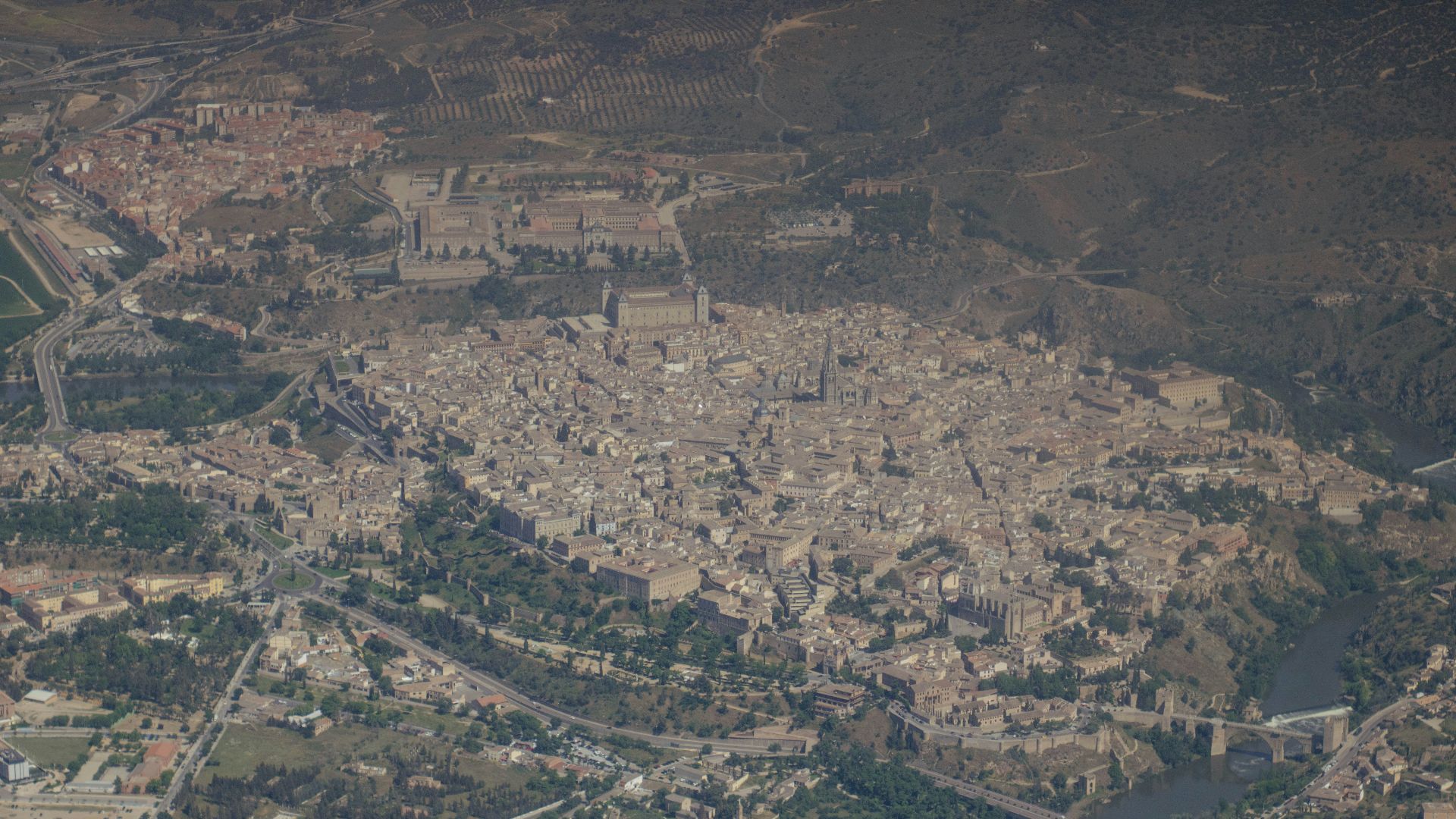 an aerial view of a city with a river running through it