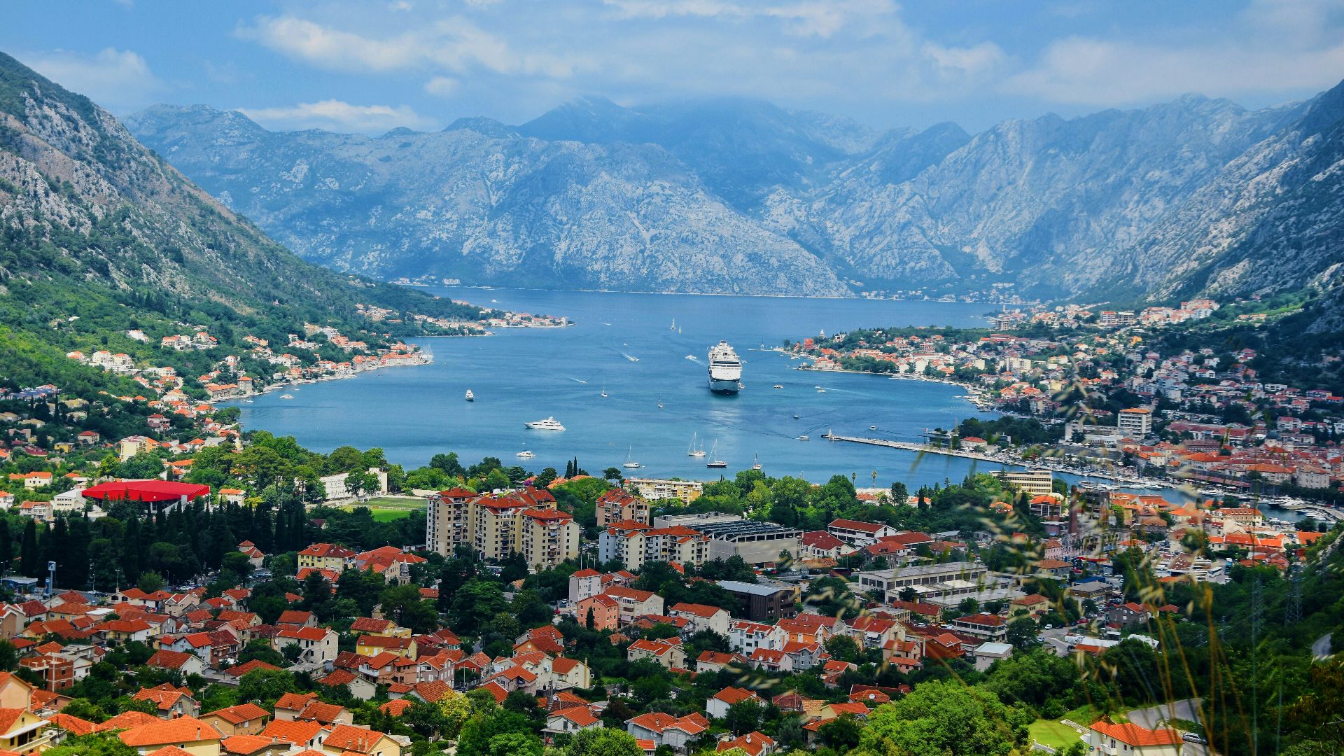 aerial view of city near body of water during daytime