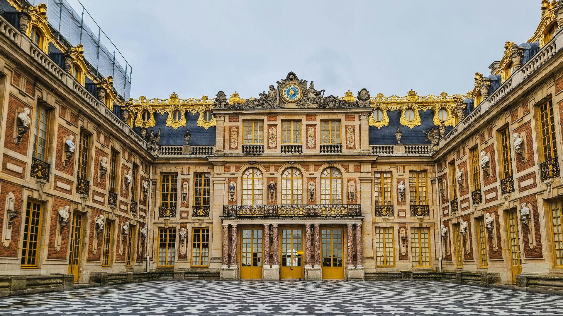a large building with a checkered floor in front of it