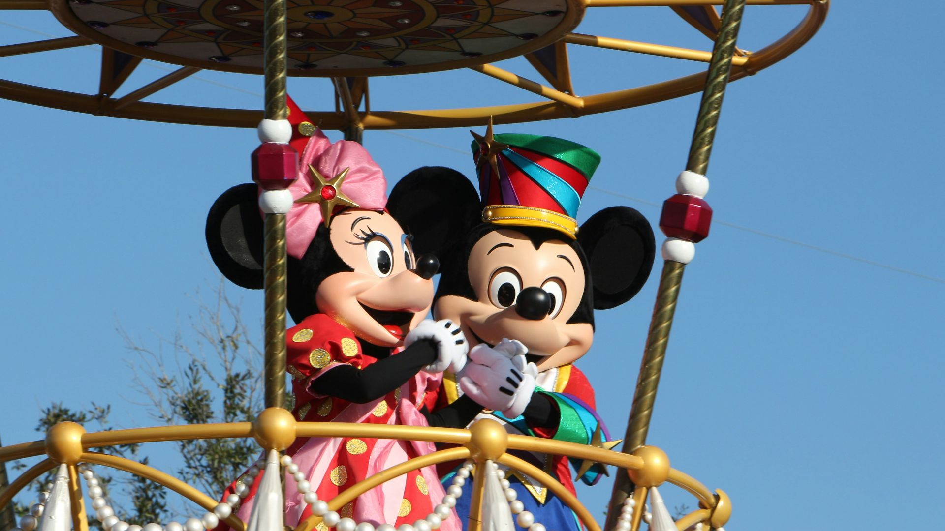mickey mouse riding on swing ride