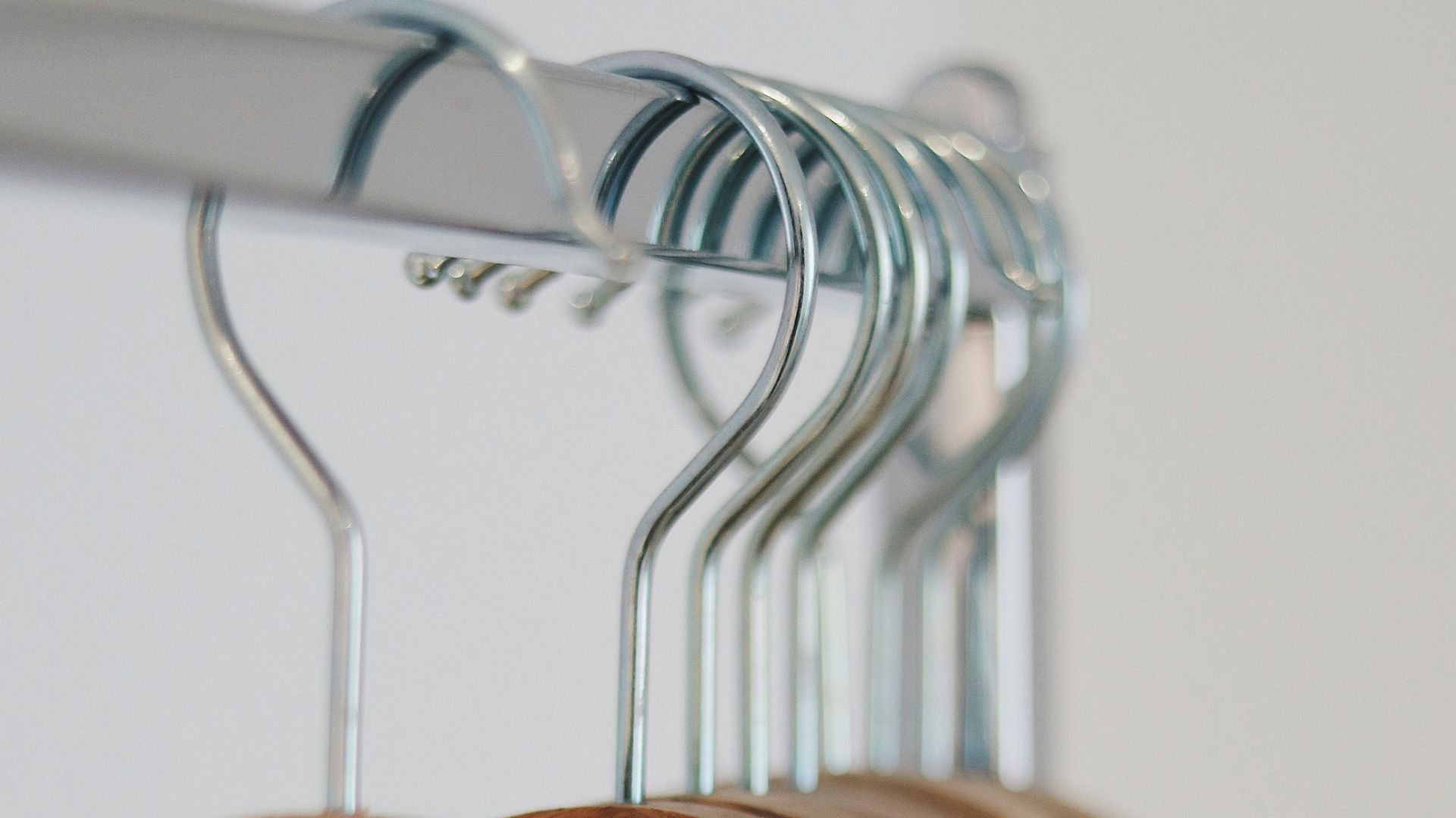 brown wooden clothes hangers