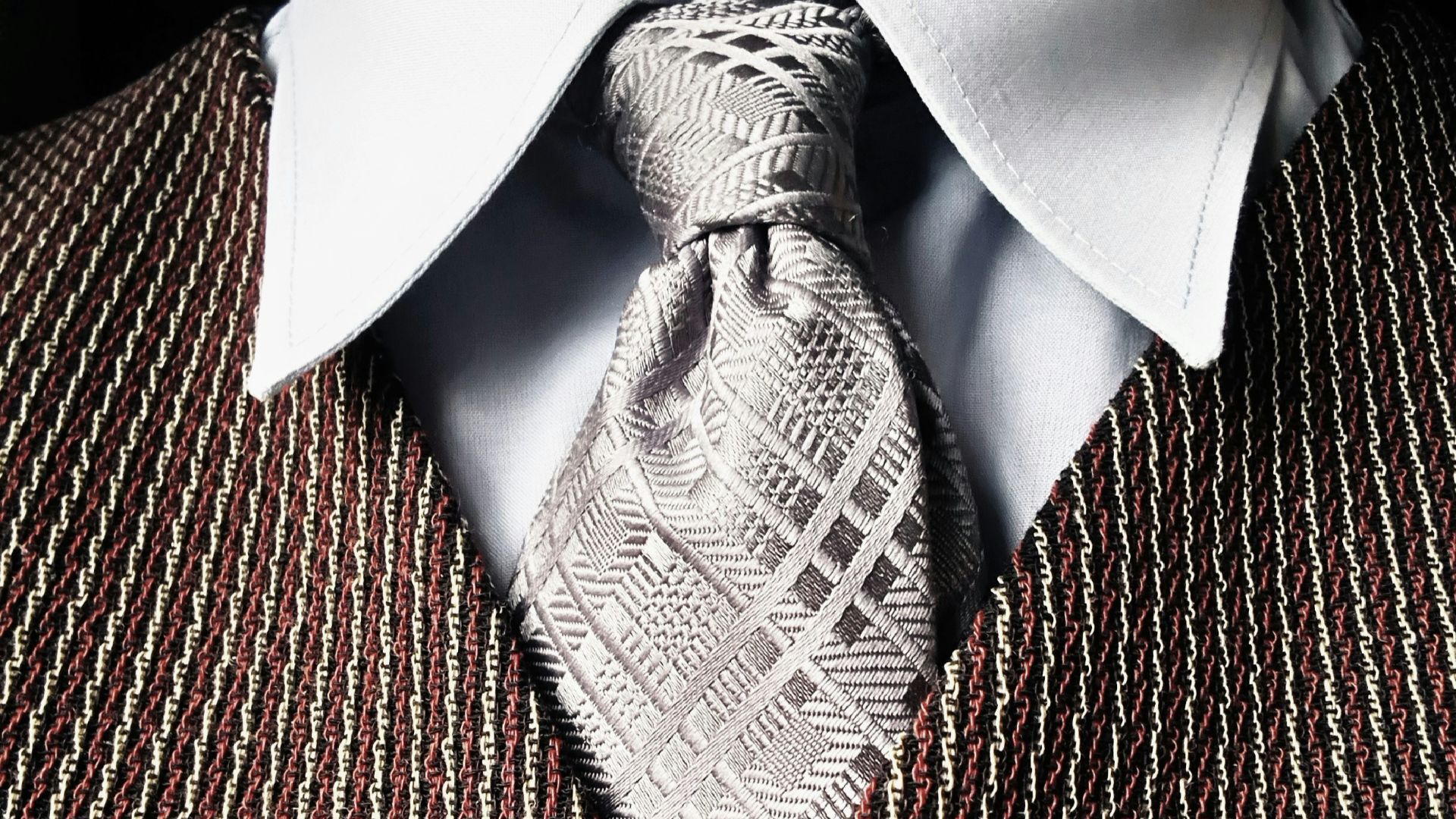 gray necktie and brown button-up vest