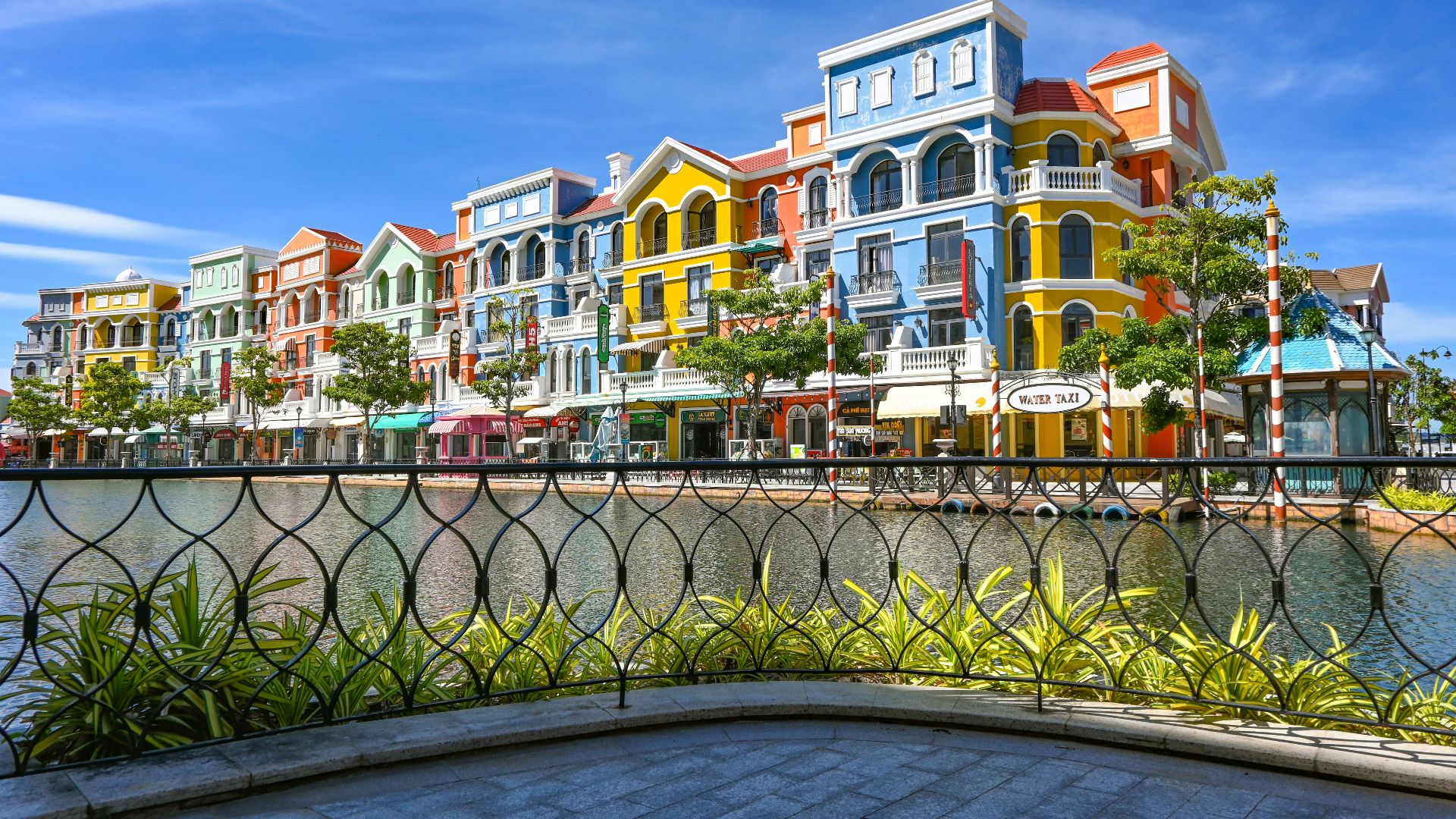 Vibrant, colorful buildings line the waterfront.