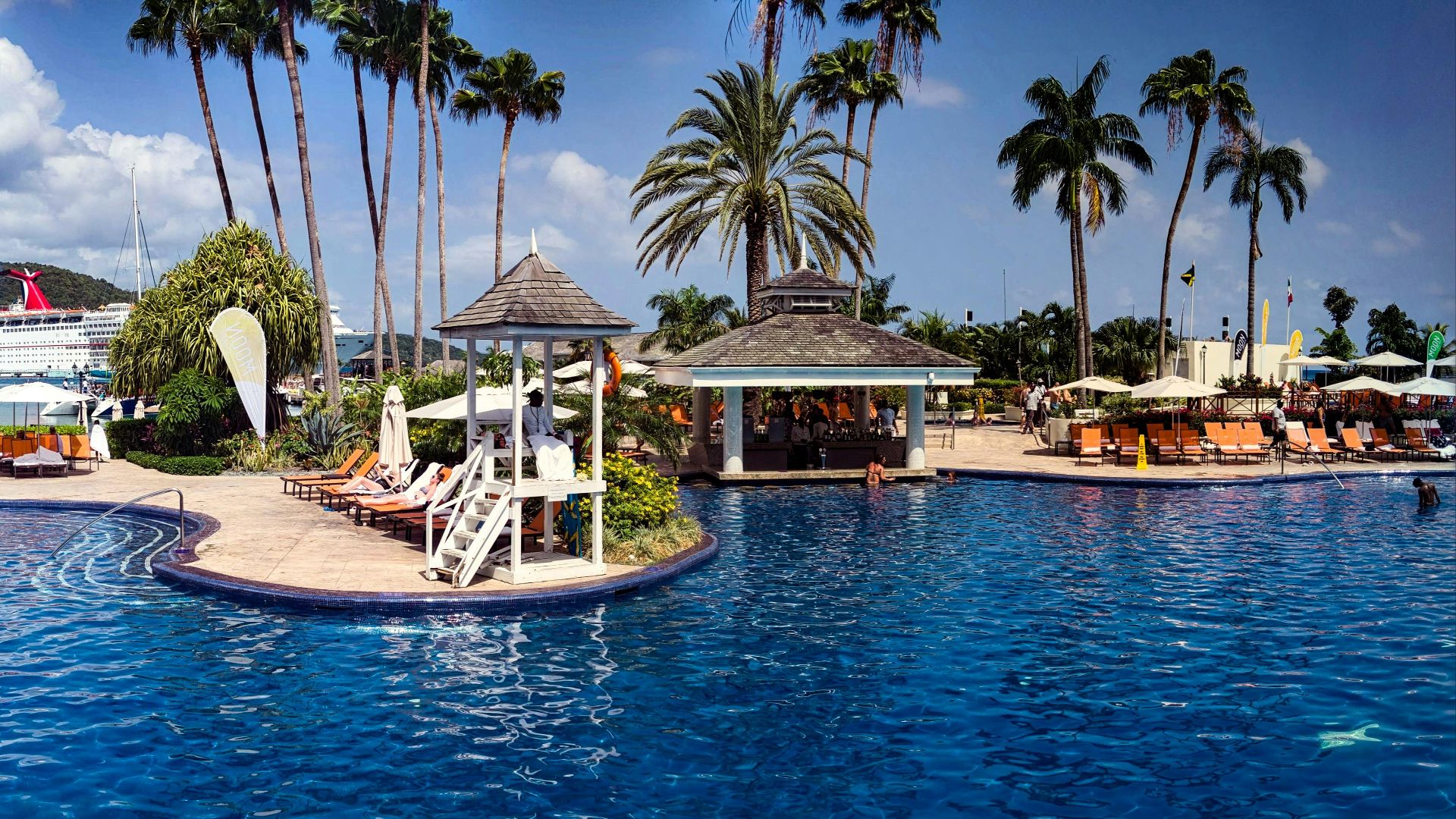 photo of gazebo and green palm trees scenry