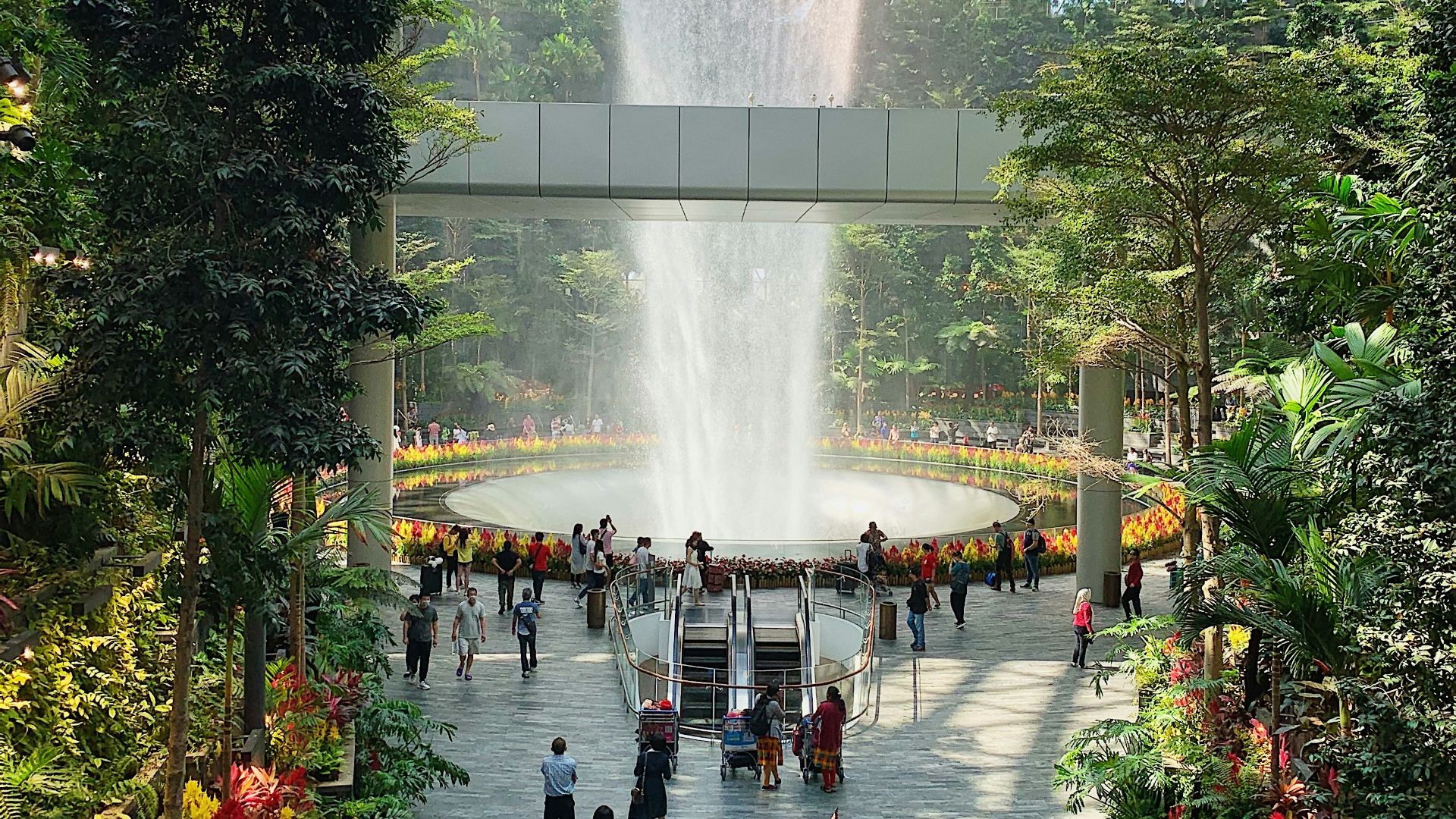 people walking on white concrete building during daytime