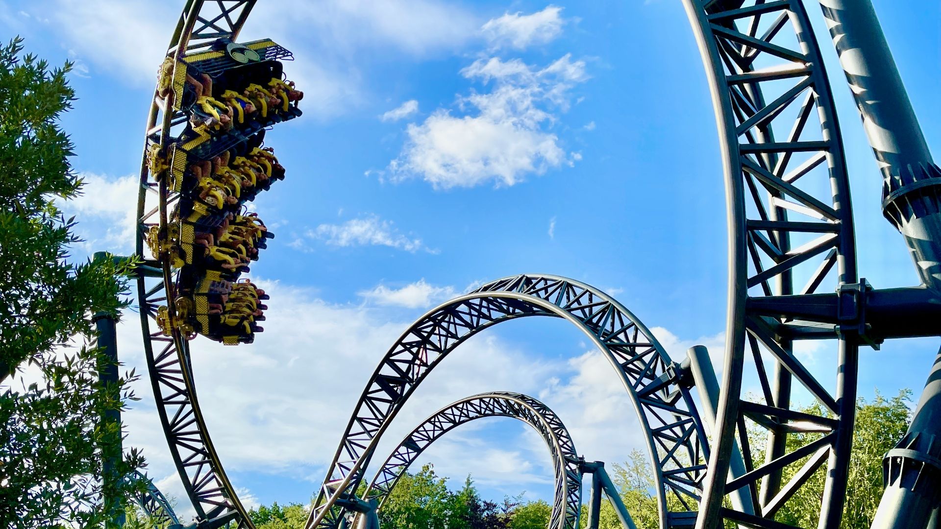 green and brown roller coaster under blue sky during daytime