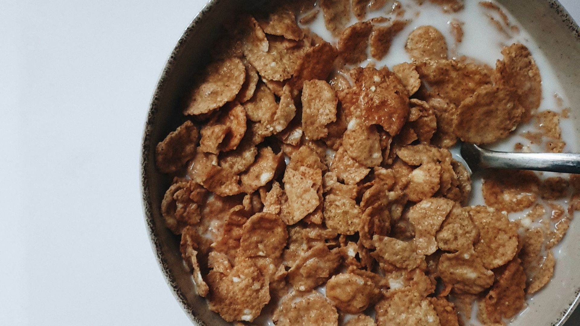 a bowl of cereal with a spoon in it