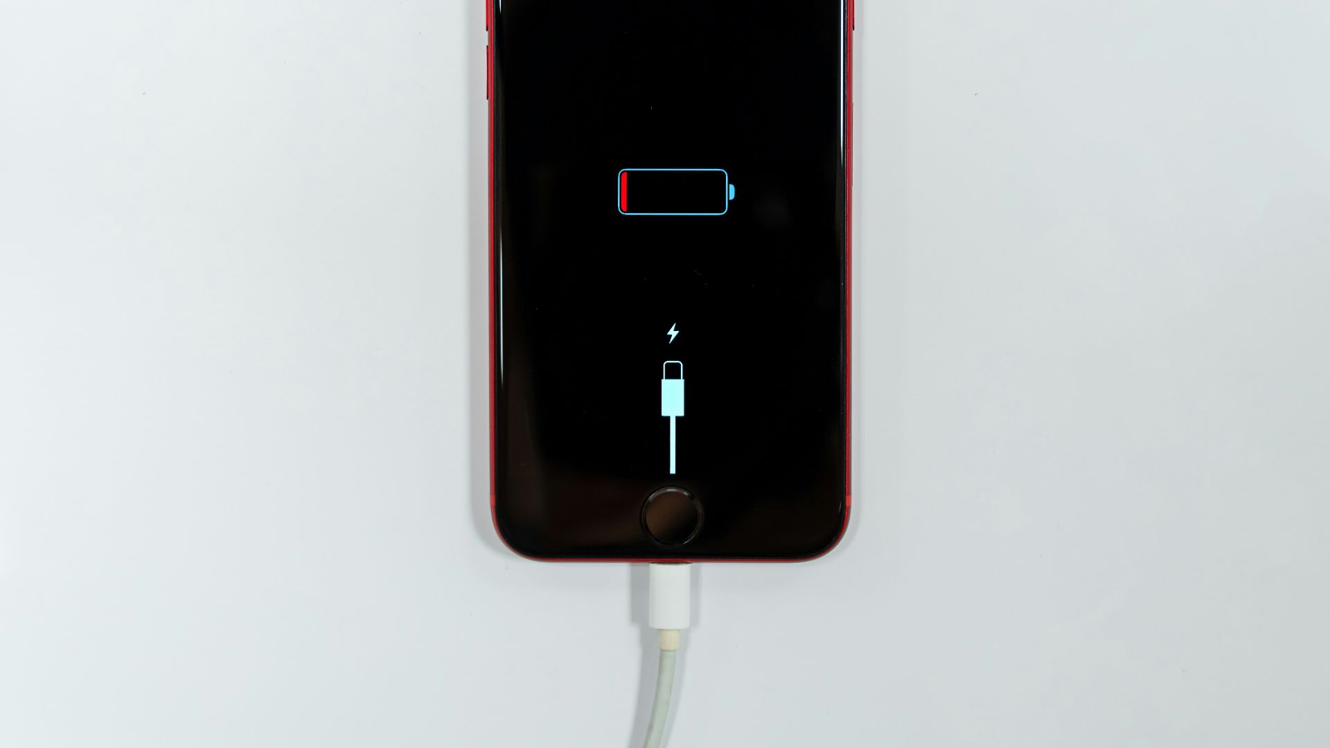 black iphone 5 on white surface