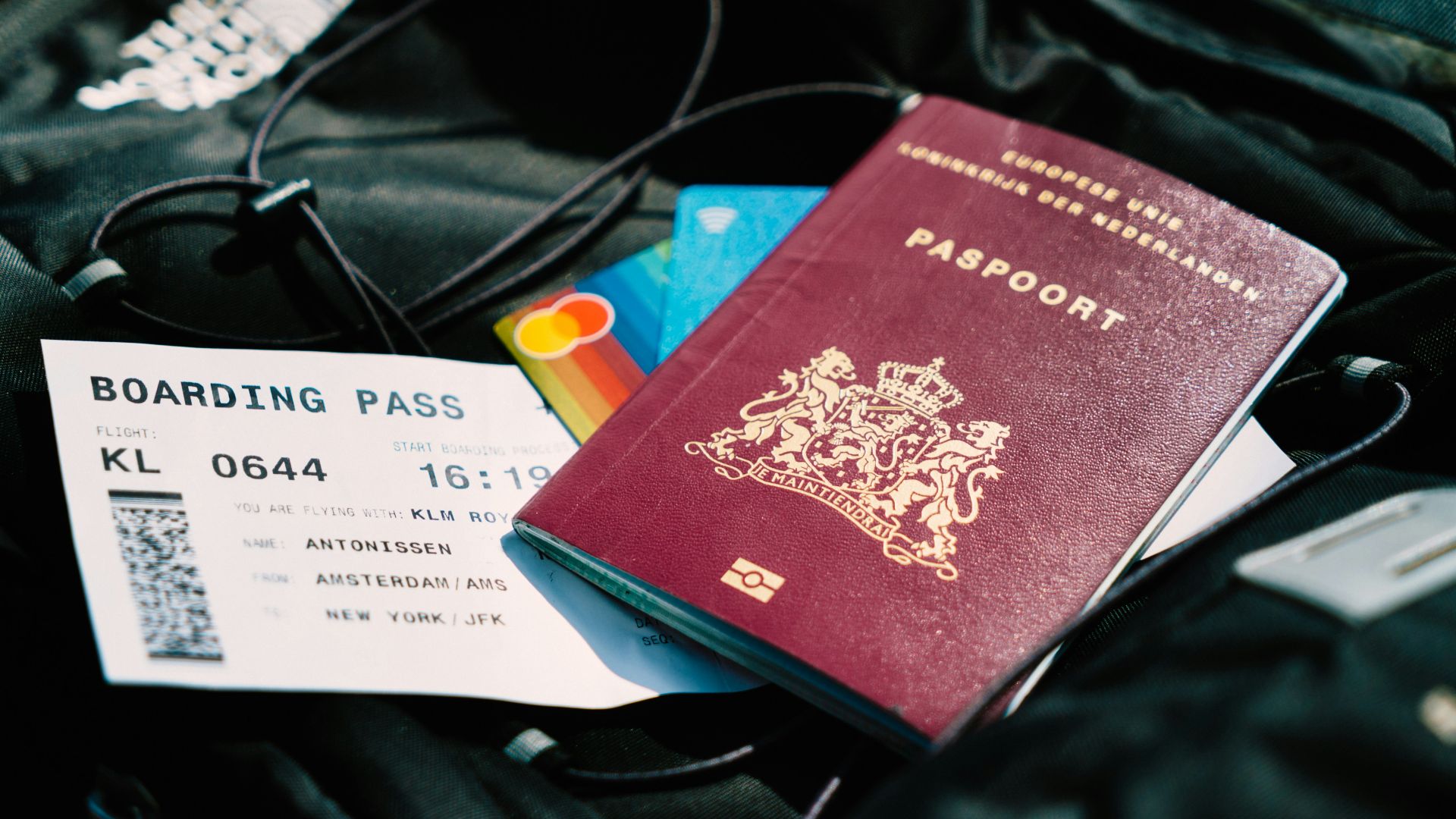 a passport and a boarding pass are on a bag