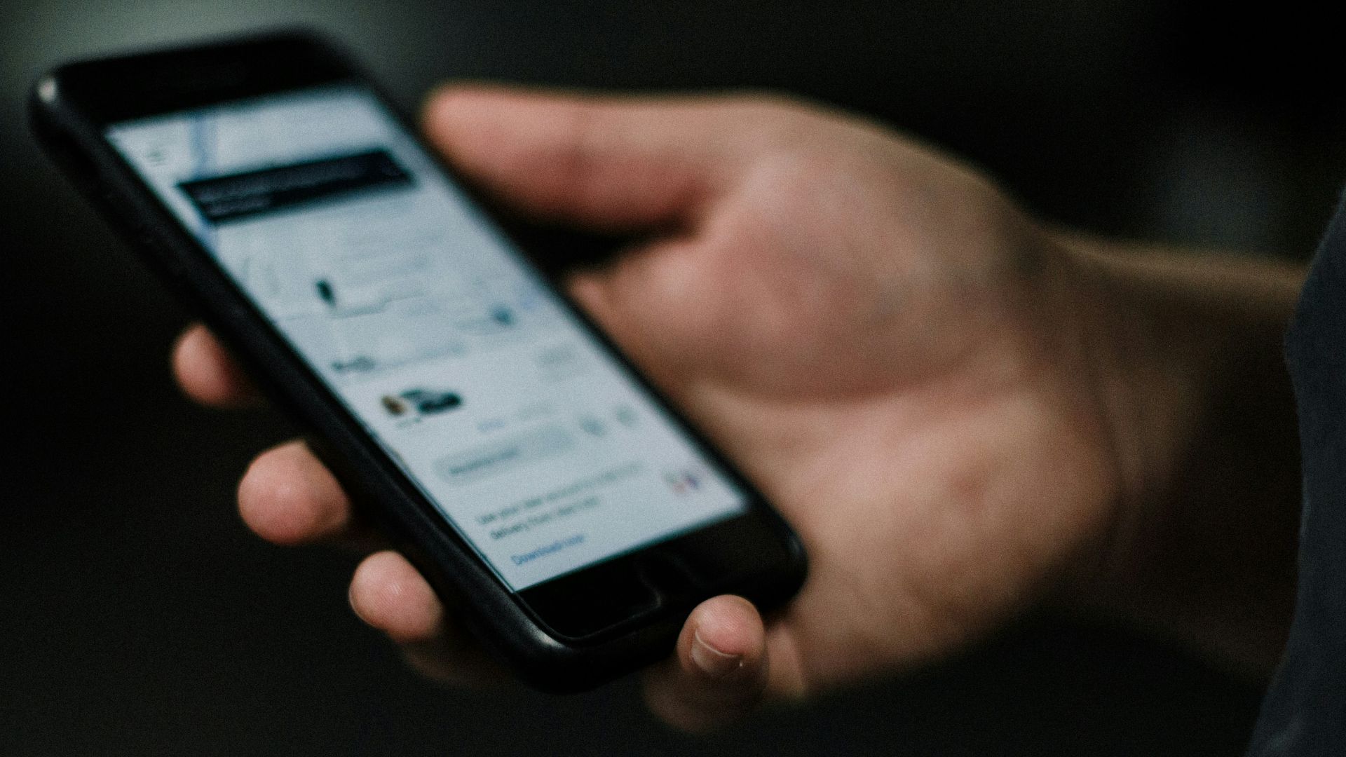 person holding black iphone 5