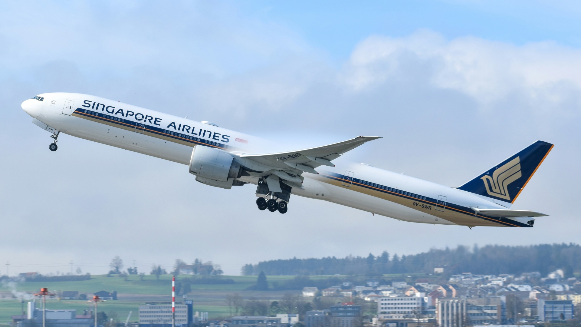 A large jetliner flying through a blue sky