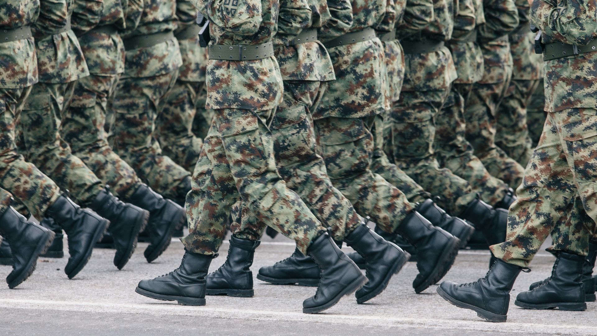 men in green and brown camouflage uniform