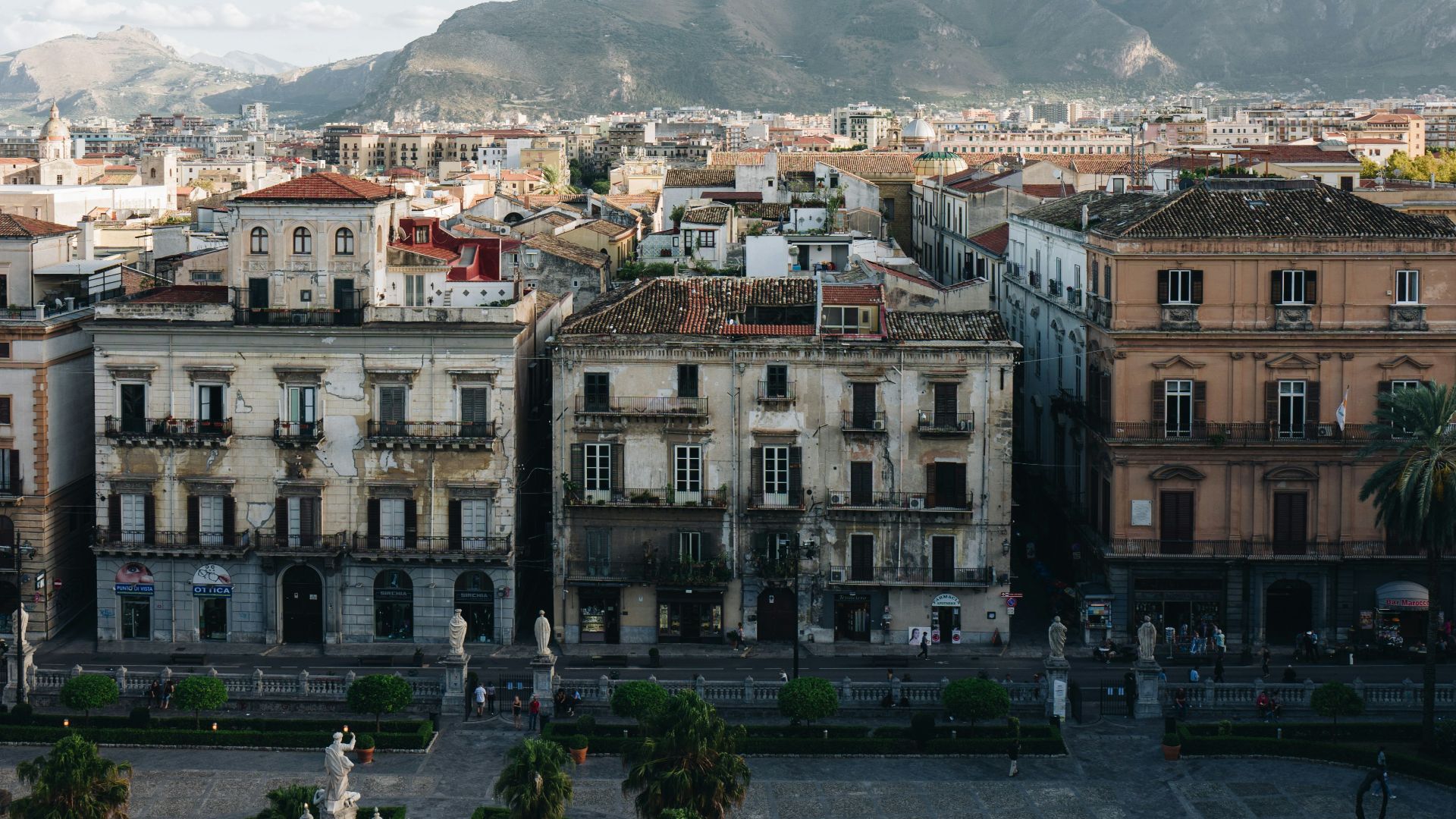 concrete buildings near mountain