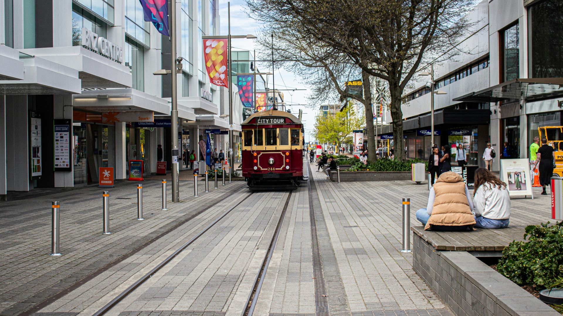 tram passing by the city streets during daytime
