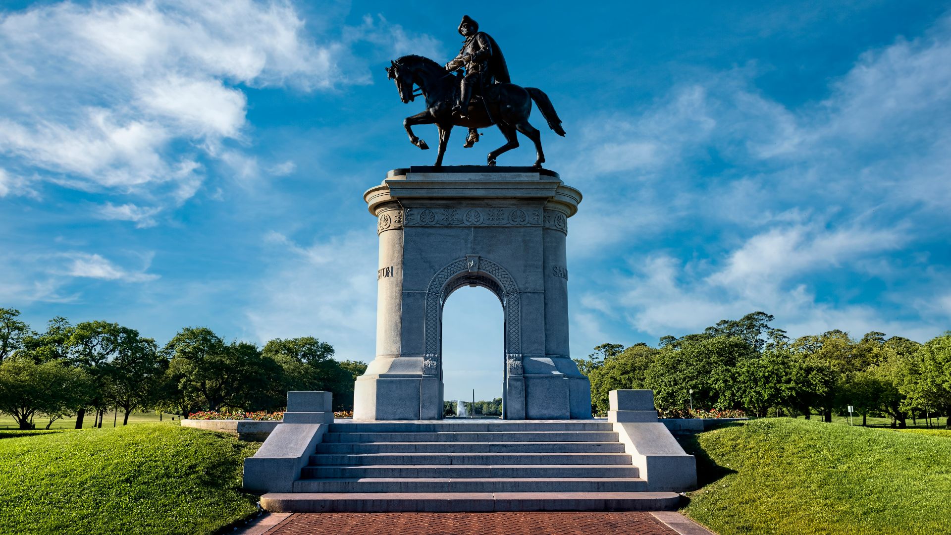 black horse statue under blue sky during daytime
