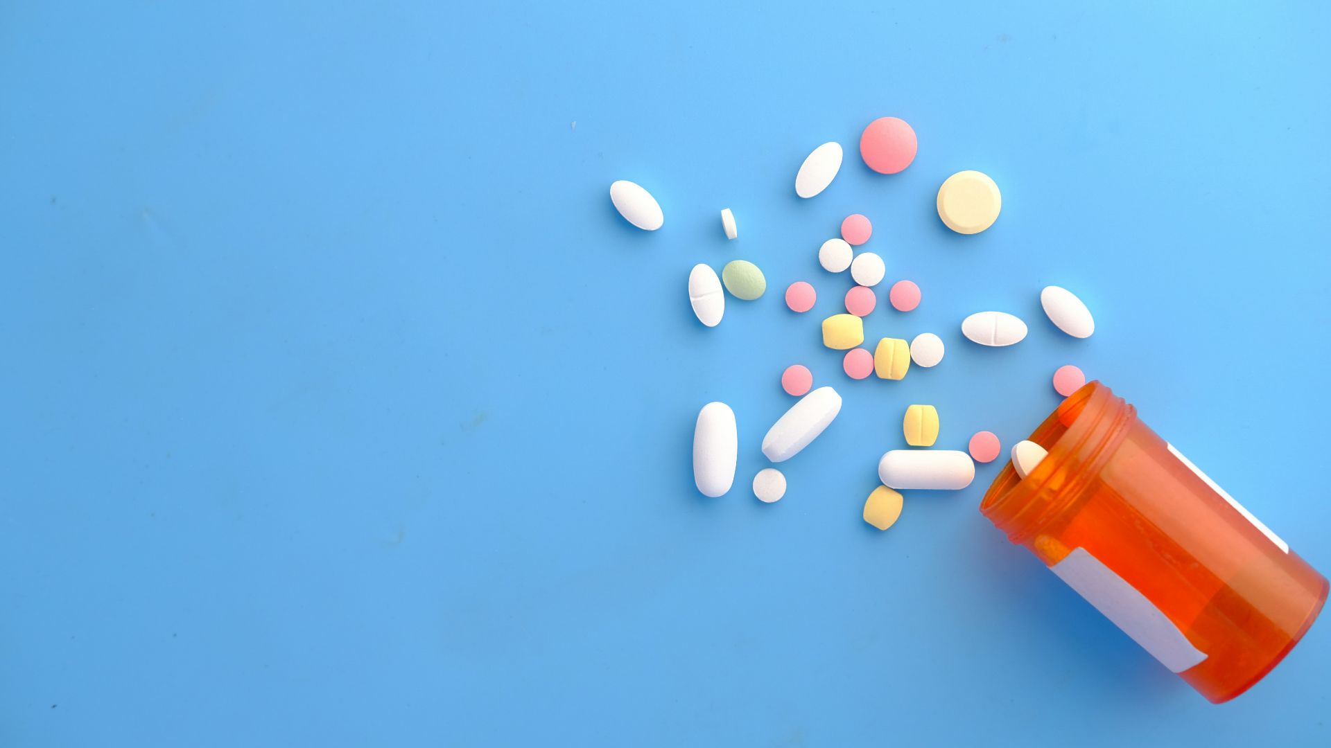 orange and white medication pill