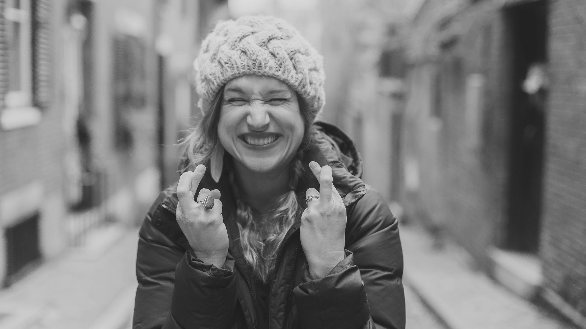 woman in black leather jacket smiling